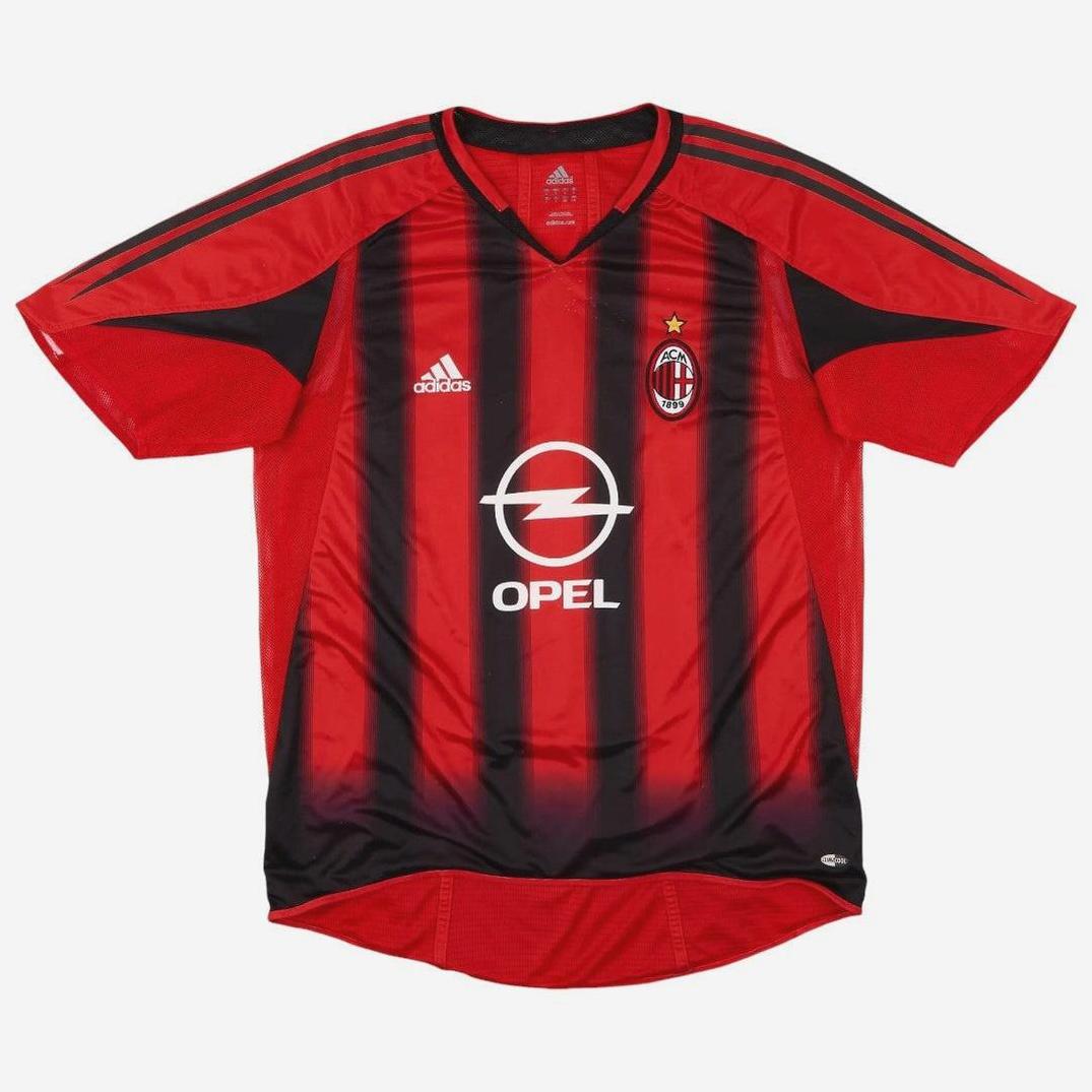 The Retro1999 AC Milan 2004-05 Home Shirt features red and black stripes, short sleeves, Adidas logo, Opel sponsor, and a star-topped club crest on the front. This retro kit is shown against a plain white background.