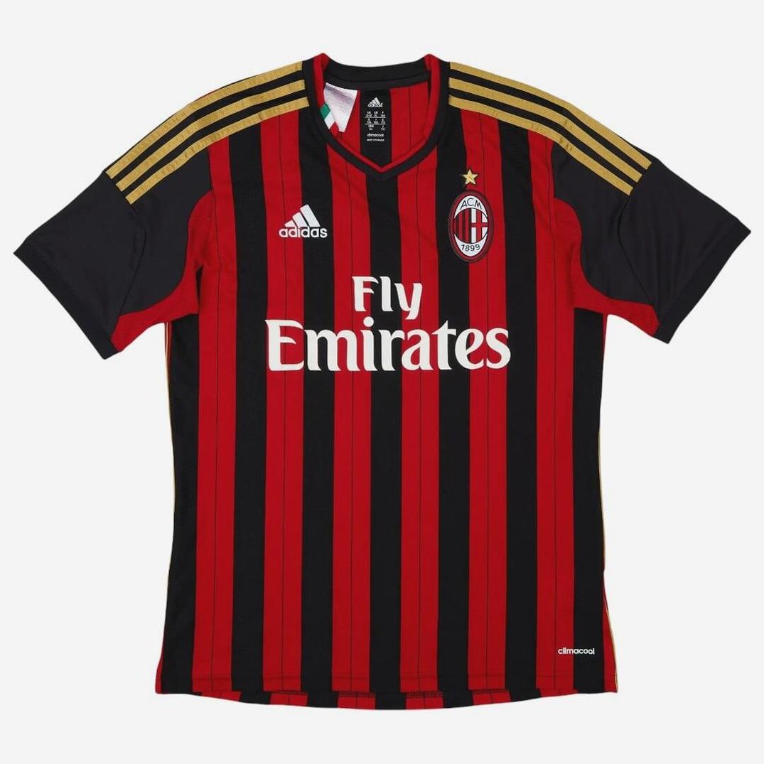 The Retro1999 AC Milan 2013-14 Home Shirt features classic black and red stripes, gold shoulder details, Adidas logo, Fly Emirates sponsor, and the club crest with star—iconic from Serie A matches.