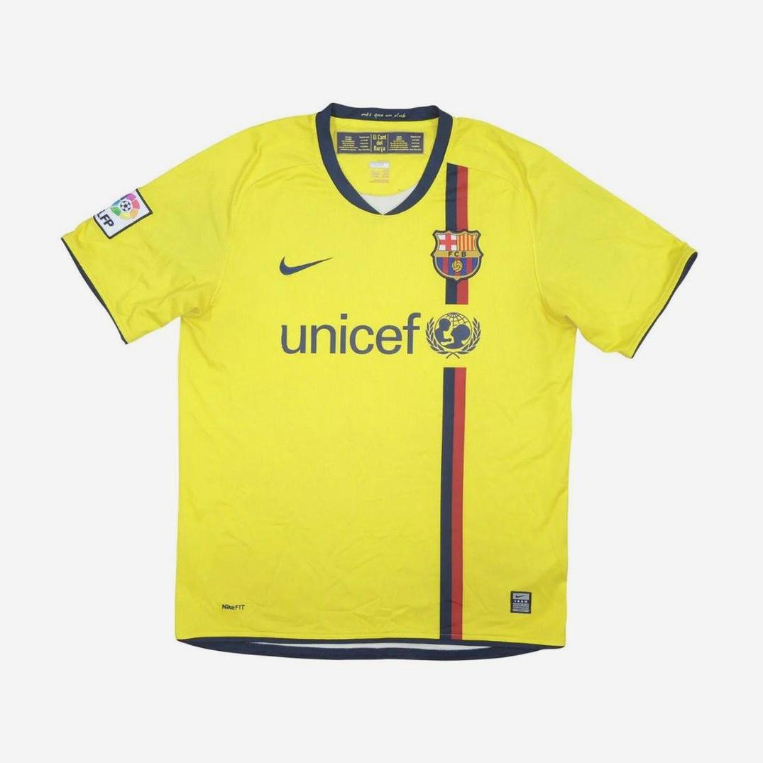 A Barcelona 2008-09 Away Shirt by Retro1999, yellow with Nike logo, UNICEF sponsor, club crest, and vertical red and blue stripe, made from premium-quality material and displayed flat on a white background.