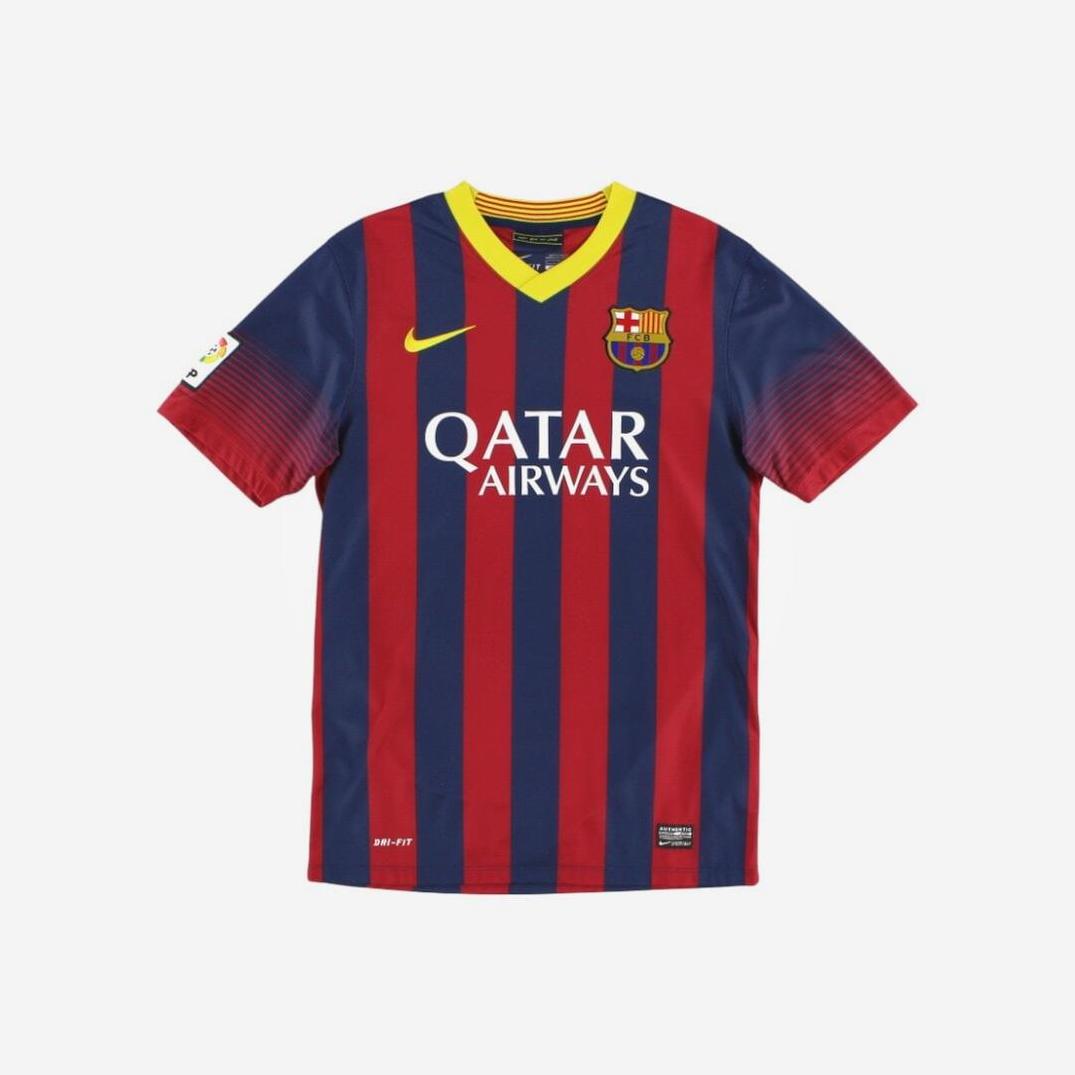The Retro1999 Barcelona 2013-14 Home Shirt features red and blue vertical stripes, a yellow collar, Nike logo, club crest, Qatar Airways sponsor, and La Liga sleeve patch—bringing retro style to your collection.