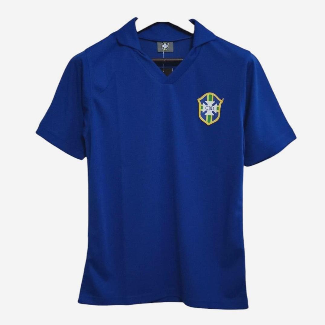 The Retro1999 Brazil 1957 Away Shirt, a blue collared short-sleeve soccer jersey with the CBF crest on the left chest, hangs on a black hanger against a white background.