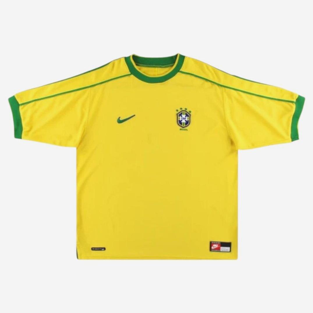 The Retro1999 Brazil 1998 Home Shirt is a yellow jersey with green trim on the collar and sleeves, inspired by classic football heritage, and features the team crest on the chest.