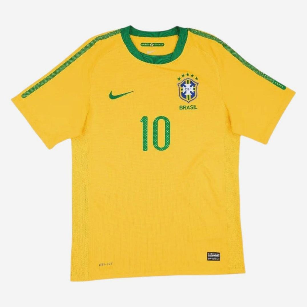 The Retro1999 Brazil 2010 Home Shirt features a yellow design with green trim, number 10, and team crest with five stars—a classic tribute to Brazils football heritage.