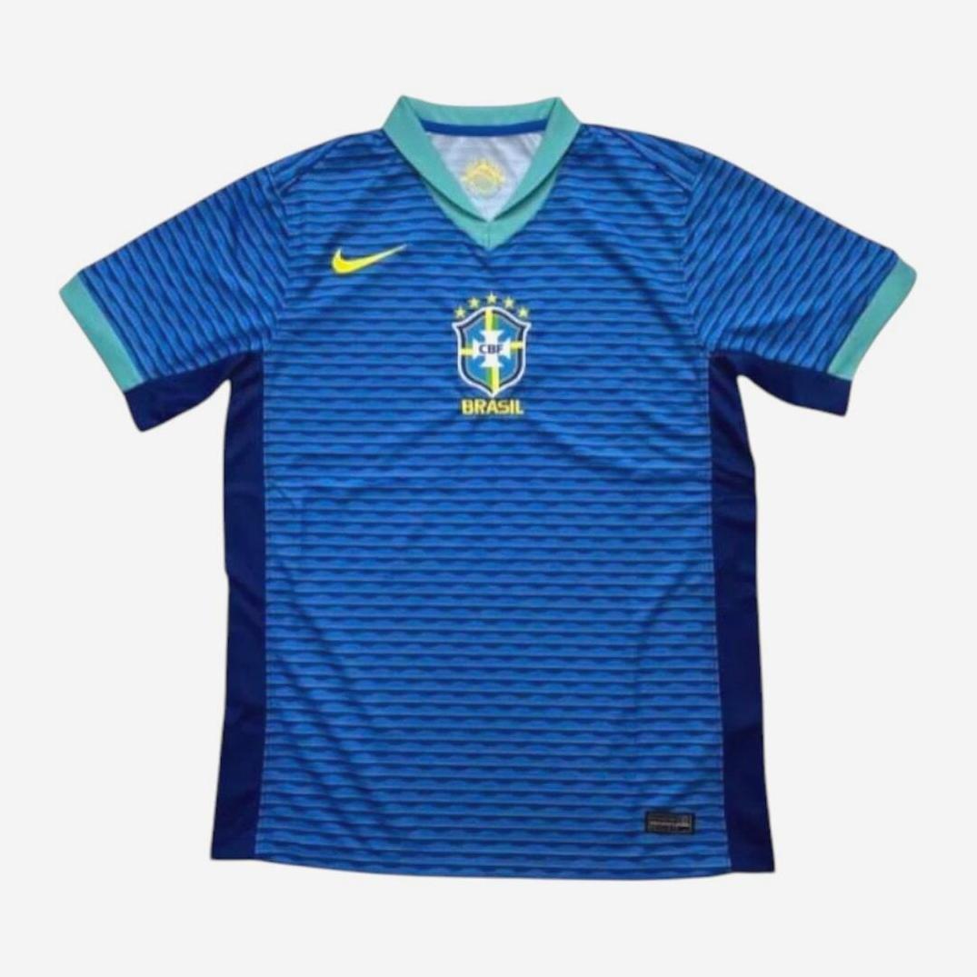 The Brazil 2024 Away Shirt by Retro1999 features premium blue fabric, a light blue collar and cuffs, a yellow Nike logo on the right chest, Brazil crest on the left chest, and Brasil below the crest.