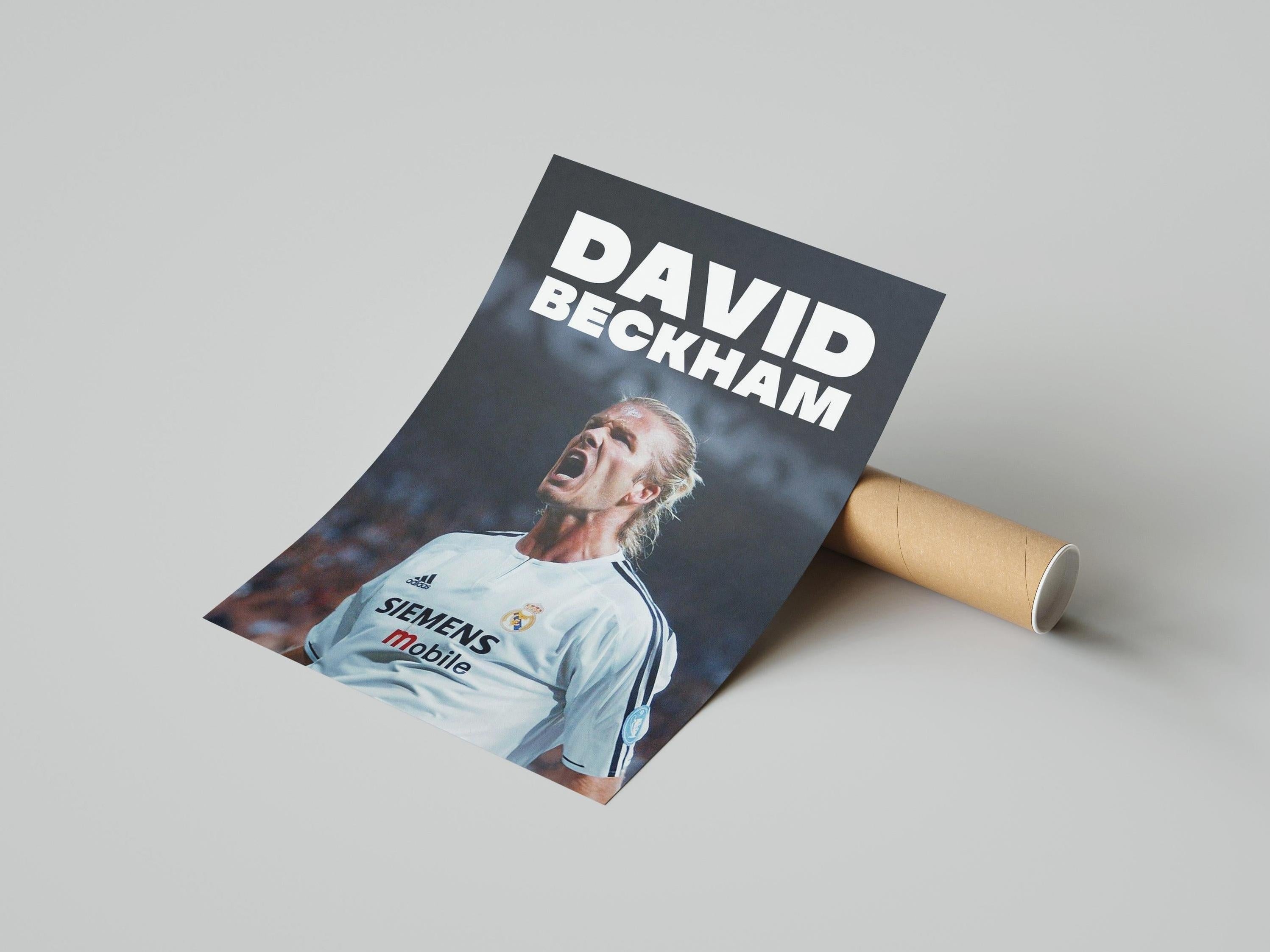 The David Beckham x Real Madrid Poster by Retro1999 features Beckham in a white jersey, passionately shouting—an iconic tribute to football history and a must-have for fans.