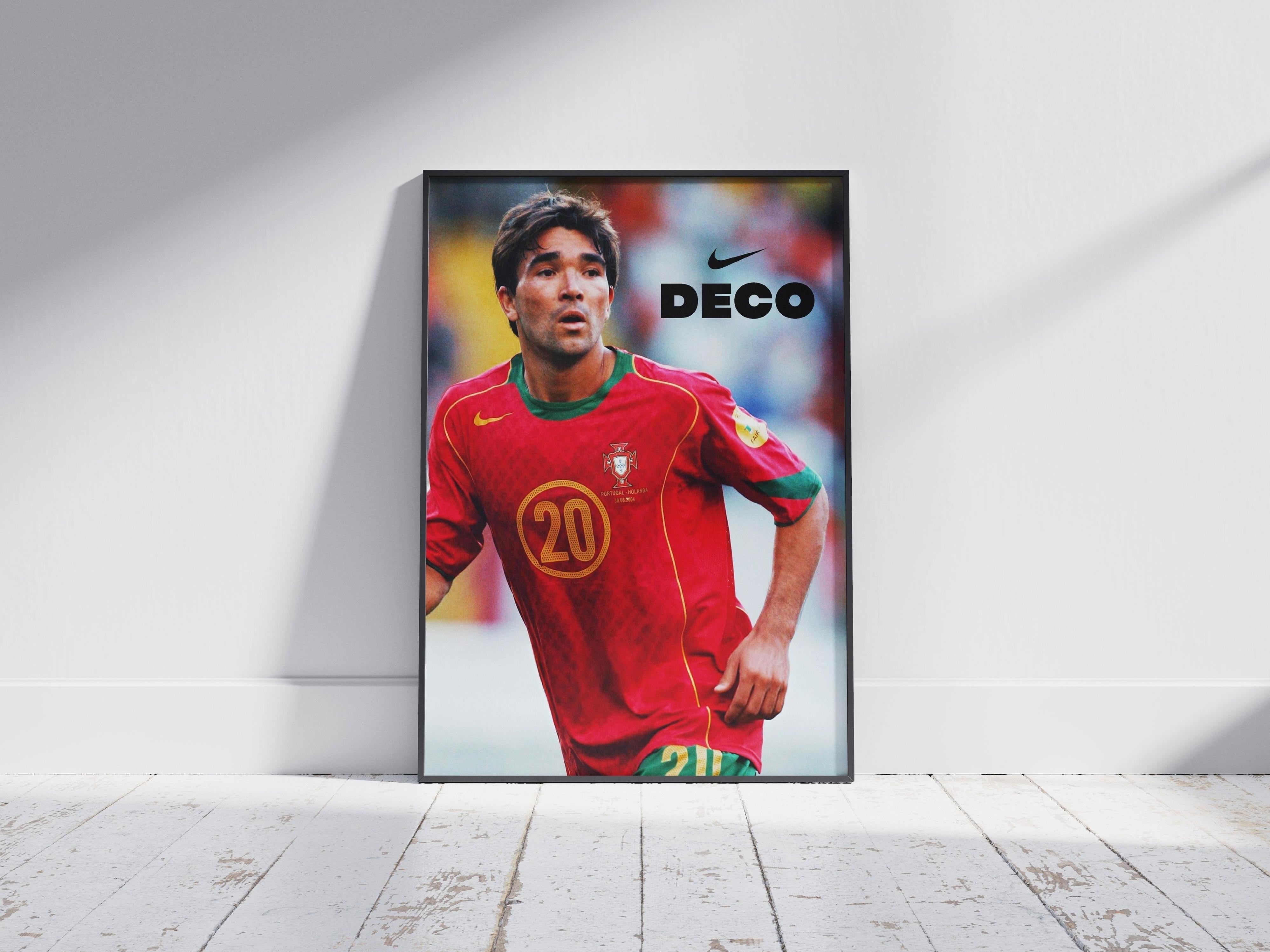 The Deco x Portugal 2004 Poster by Retro1999 features Deco in his red #20 jersey against a blurred background, with DECO and the Nike logo at the top right. Ideal for UEFA Euro 2004 fans, it is framed and displayed on a white wooden floor.