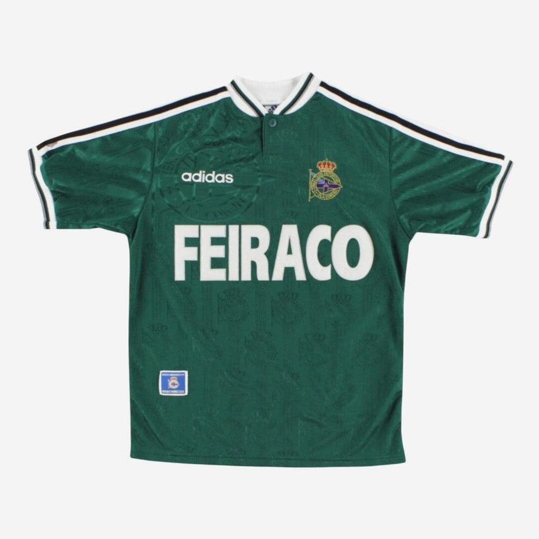 The Retro1999 Deportivo 1998-99 Away Shirt is green with black and white trim, a left chest crest, FEIRACO sponsor on the front, and a blue lower right patch—a classic vintage pick for football shirt collectors.