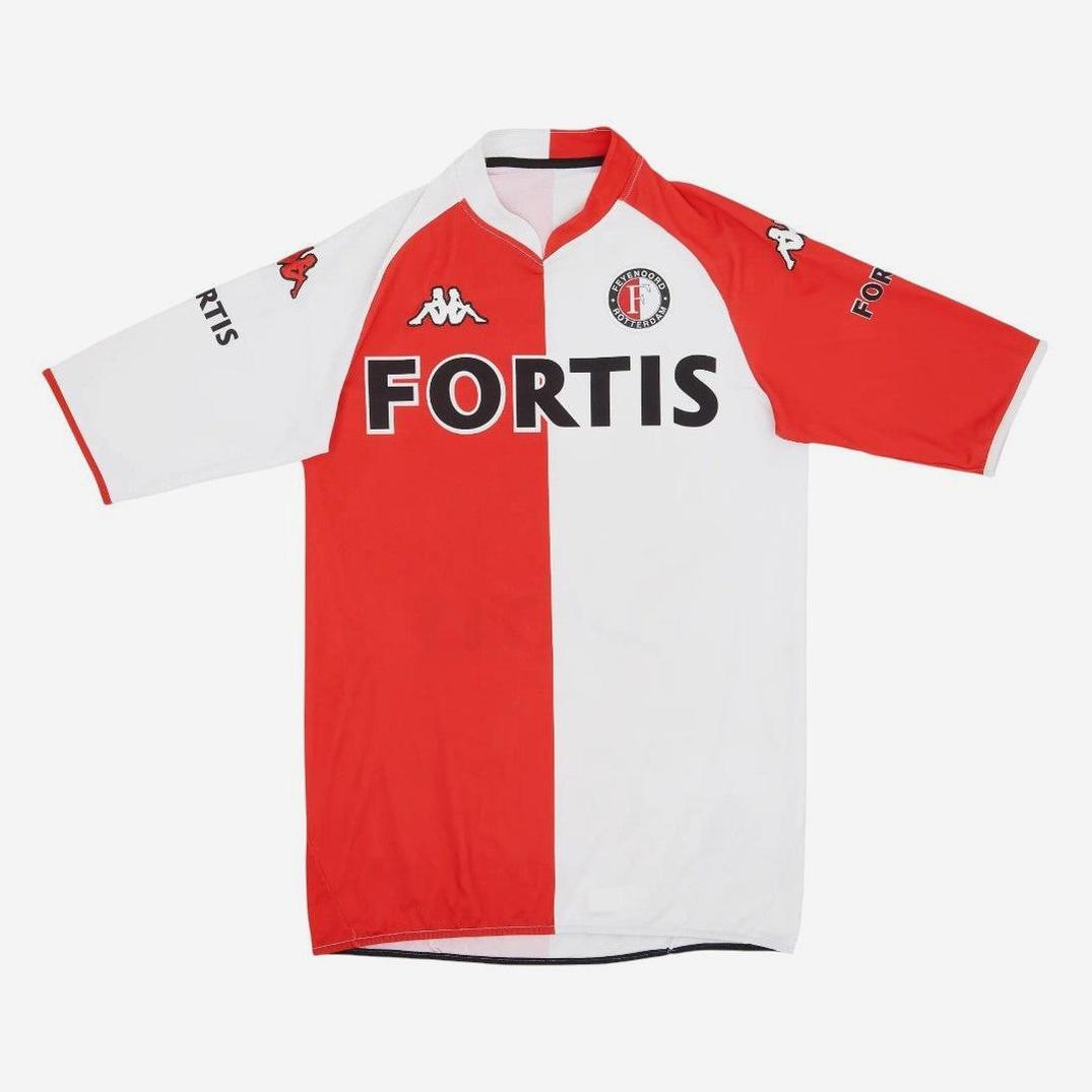 The Retro1999 Feyenoord 2007-08 Home Shirt features a red and white vertical split, black FORTIS sponsor, Kappa logo, and club crest—a classic piece of Feyenoord history.