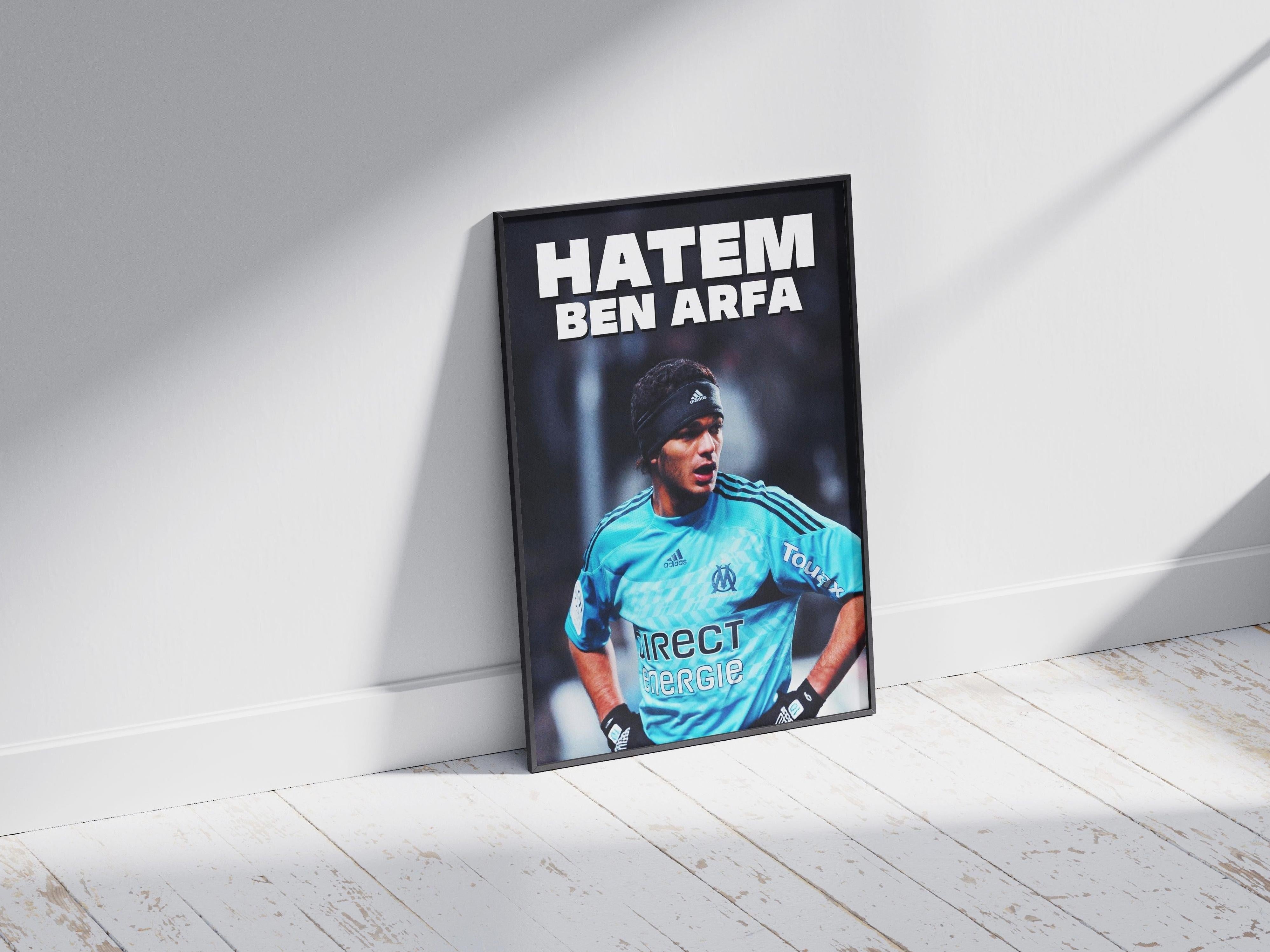 The Retro1999 Hatem Ben Arfa x Marseille Poster features the soccer star in a blue jersey with his name above, stylishly framed and leaning against a white wall on a light wood floor—an iconic tribute for football fans.
