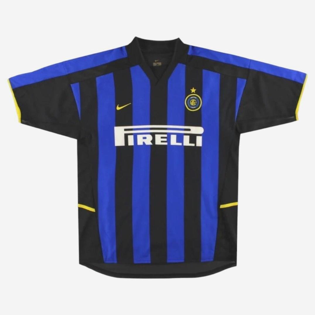 The Retro1999 Inter Milan 2002-03 Home Shirt features blue and black stripes with yellow accents, Nike logo, Pirelli sponsor, and a starred club badge—capturing football history against a white background.