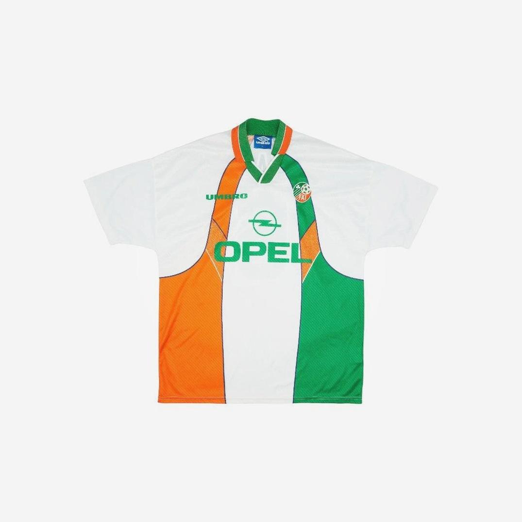 The Retro1999 Ireland 1994/96 Away Shirt features short sleeves, orange, white, and green vertical stripes, the Opel logo, Umbro branding, and a round badge—mirroring the iconic classic design.
