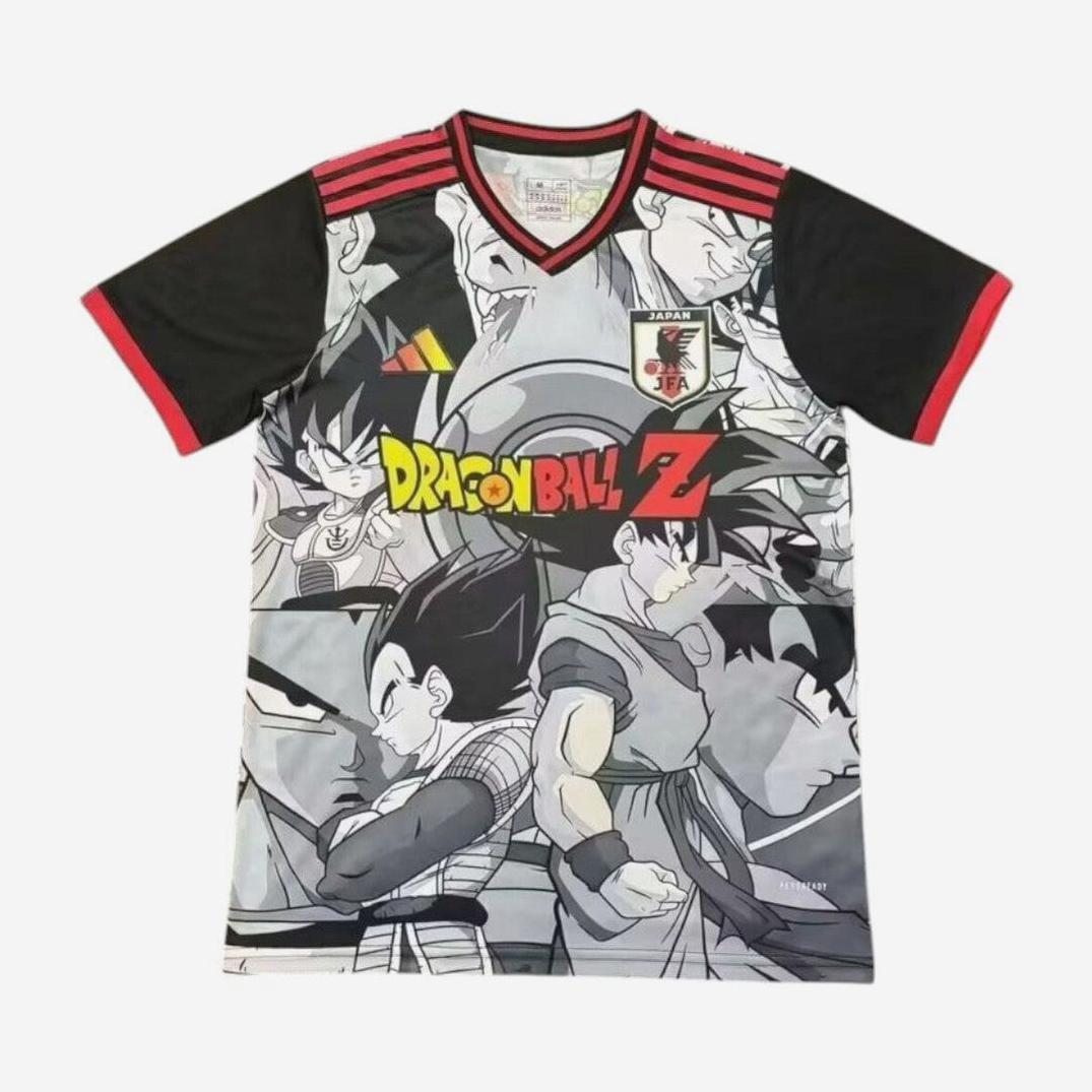 The Retro1999 Japan 2024 DragonBall Z Special Edition Shirt is a black and gray soccer jersey featuring grayscale Dragon Ball Z characters, a colorful logo, Japan Football Association crest, and red shoulder and sleeve stripes.