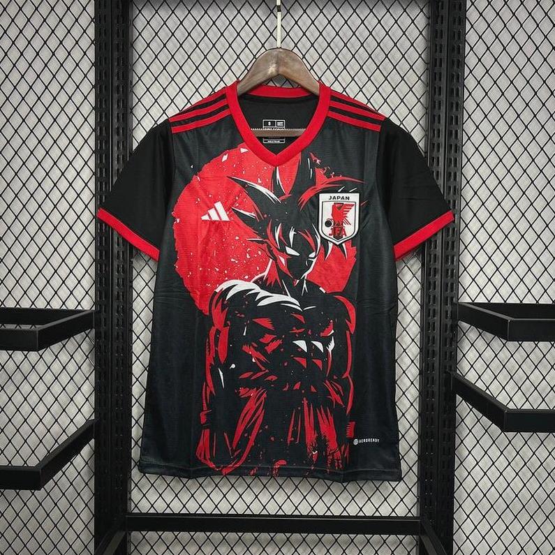 The Retro1999 Japan 2024 Special Edition Shirt is a black and red soccer jersey featuring a muscular anime character in front of a red circle, bold red accents, and the Japan team badge.