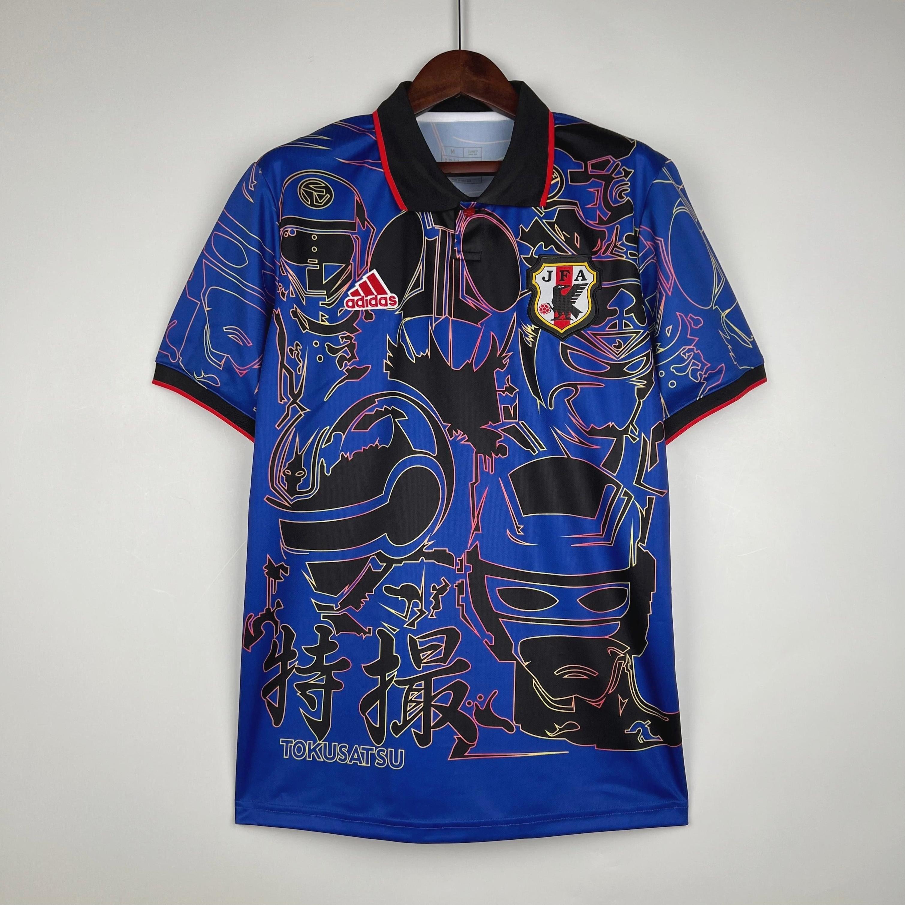 The Retro1999 Japan 2024 Special Edition is a blue soccer jersey featuring black and neon masked superhero line art, red accents, a Japan crest, TOKUSATSU lettering above Japanese characters, and celebrates Japanese culture.