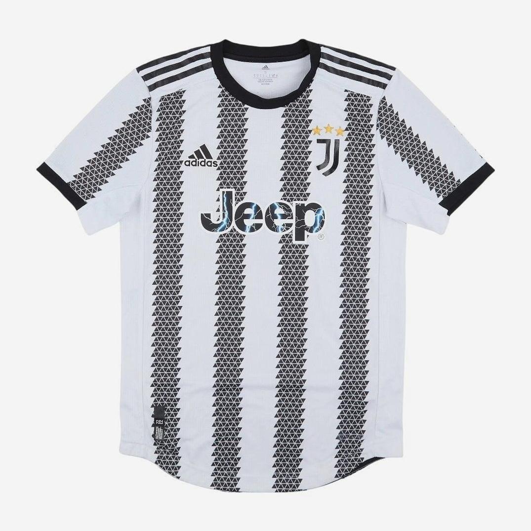 The Retro1999 Juventus 2022-23 Home Shirt is perfect for fans, featuring black and white stripes, Jeep sponsor, Adidas logo, three gold stars on the crest, plus a classic black collar and sleeve cuffs for a retro feel.