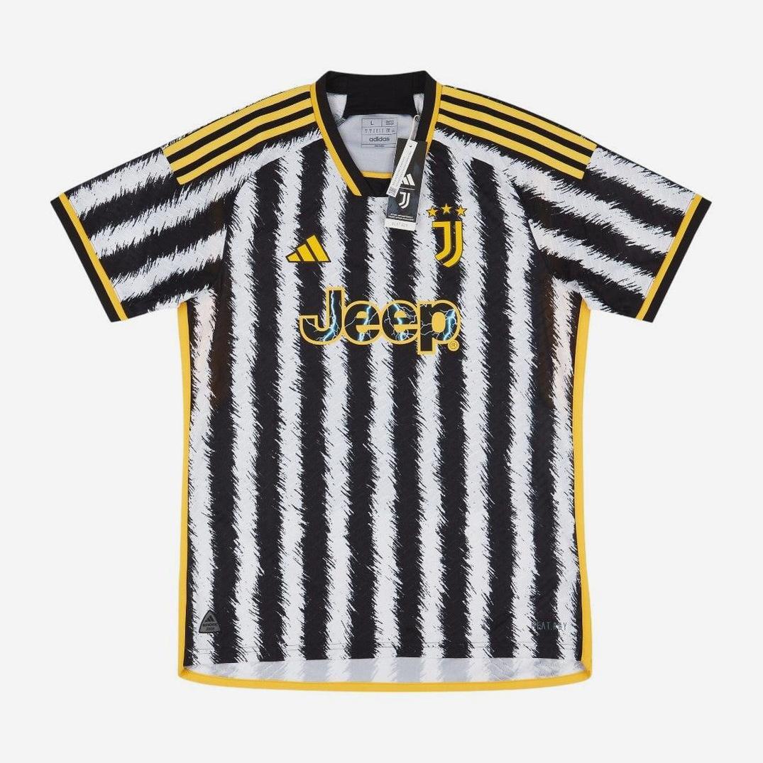 The Retro1999 Juventus 2023-24 Home Shirt sports bold black and white brushstroke stripes, yellow accents on collar, sleeves, shoulders, and features the Jeep sponsor logo—modern style for iconic Serie A fans.