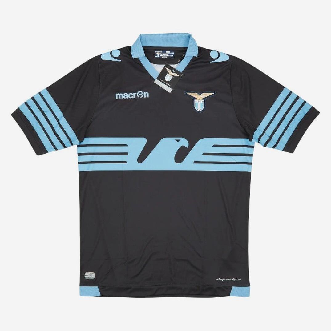 The Retro1999 Lazio 2015-16 Away Shirt features black and light blue colors, a stylized eagle graphic, and club badge—a retro kit for fans celebrating Italian football heritage.