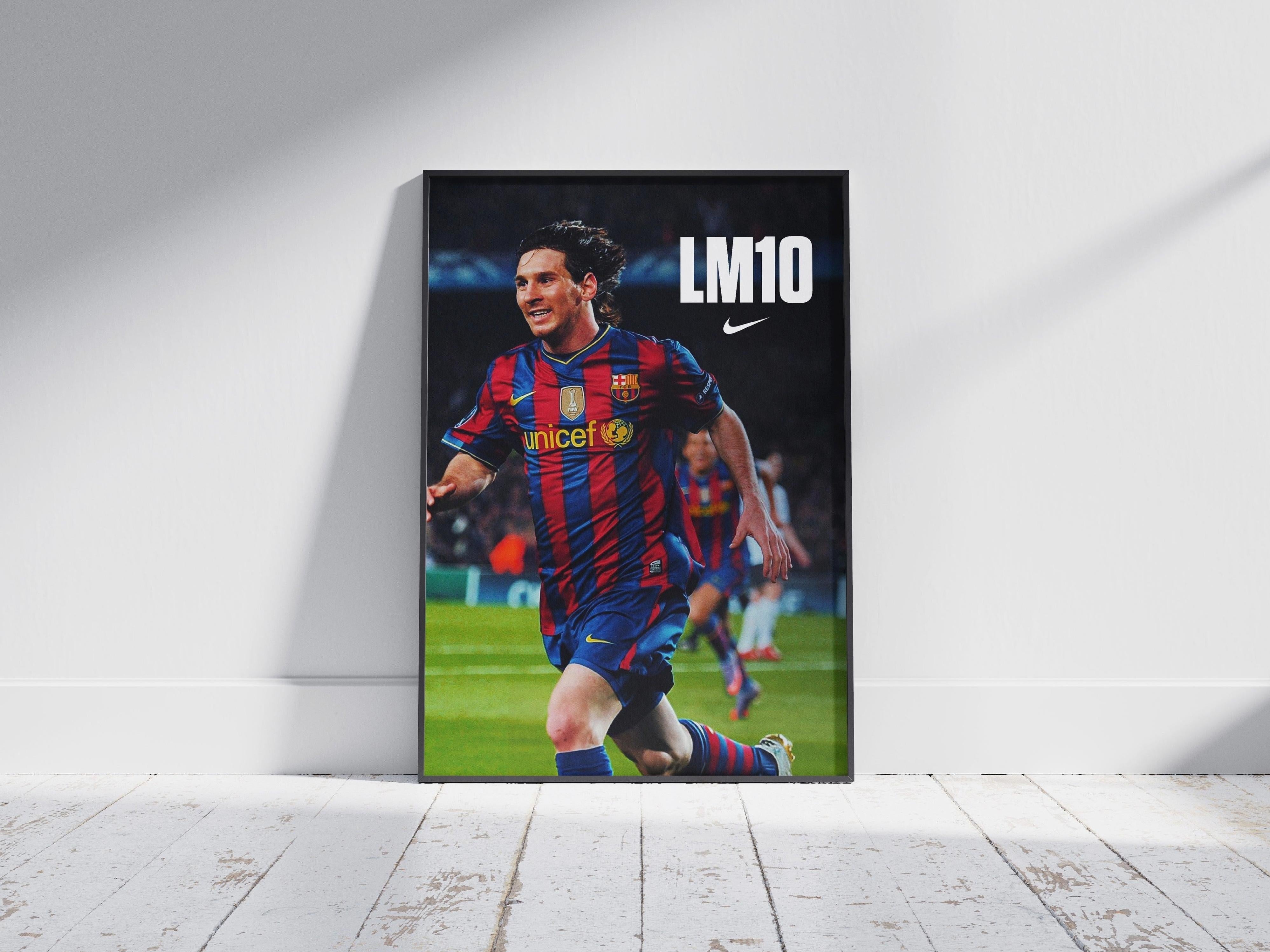 The Retro1999 Lionel Messi LM10 Poster shows Messi in a red and blue Barcelona jersey with UNICEF, sprinting on the pitch. This framed print features LM10 and Nike logos, making it ideal football memorabilia.