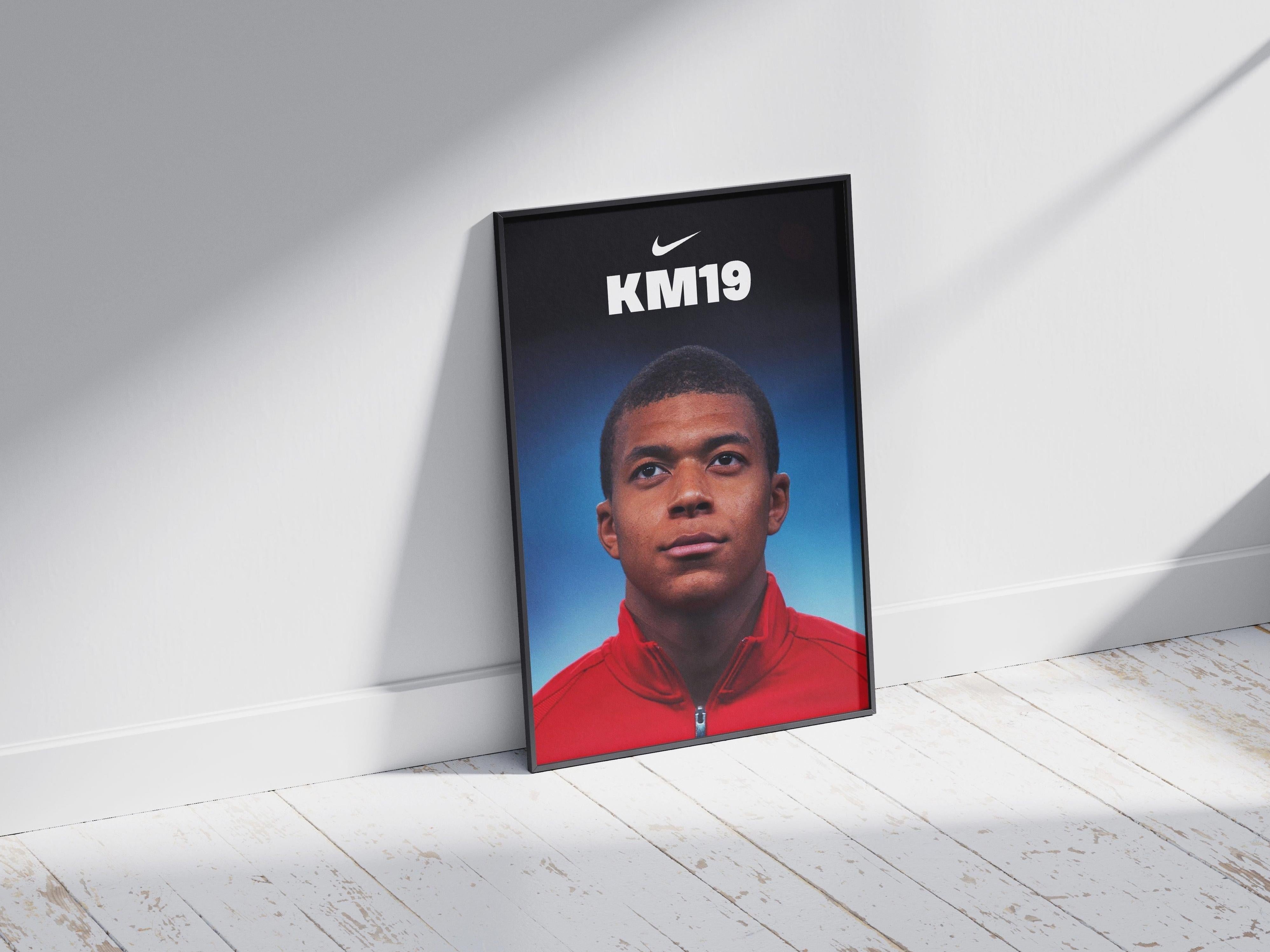 The Mbappe x AS Monaco Poster by Retro1999 shows Mbappe in a red jacket gazing upward on a blue background, with the Nike logo and KM19 above him—a framed tribute to his early career.