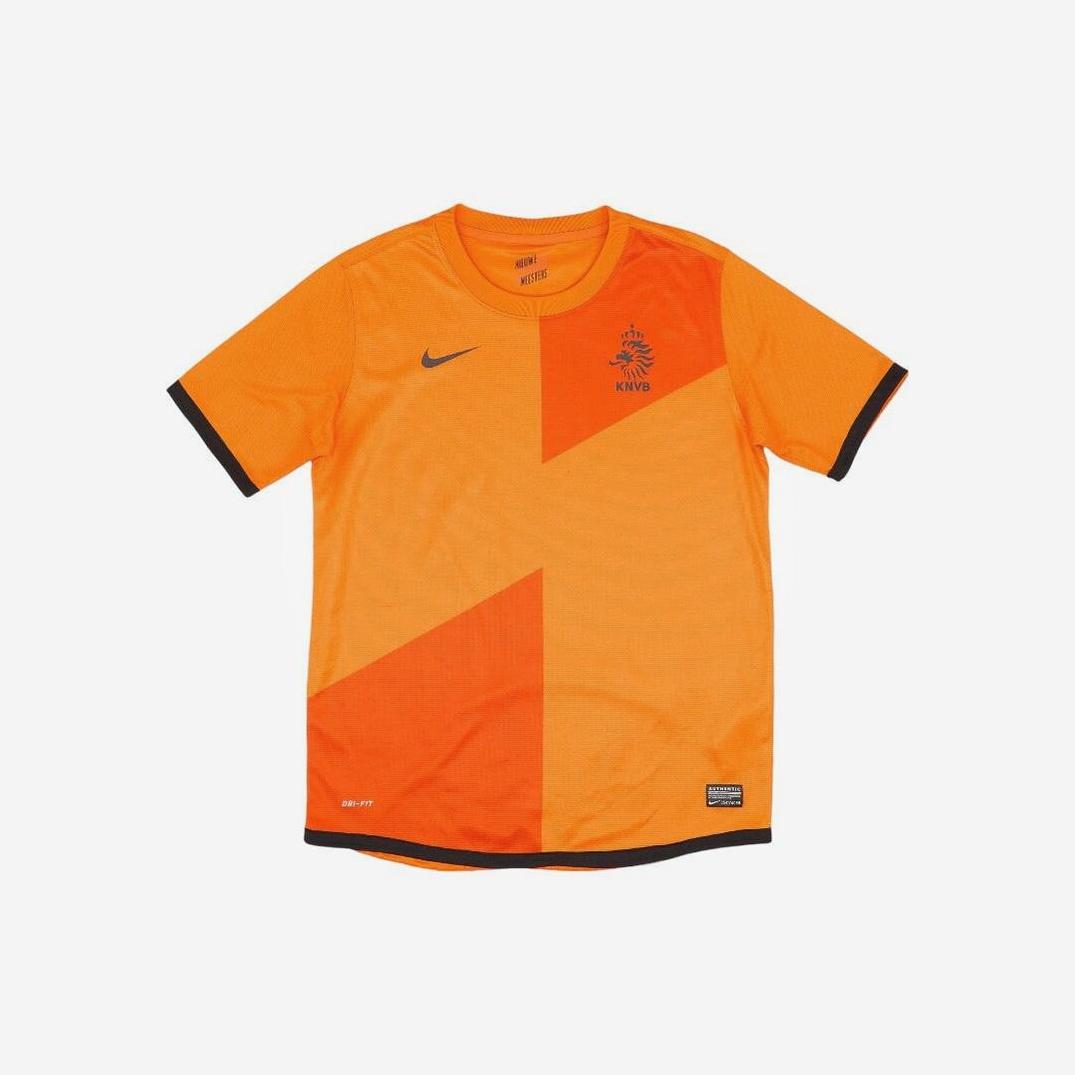 The Netherlands 2012 Home Shirt by Retro1999 features orange fabric, black trim, a Nike logo on the right chest, and the classic Dutch lion KNVB crest on the left—a must-have retro kit for fans.