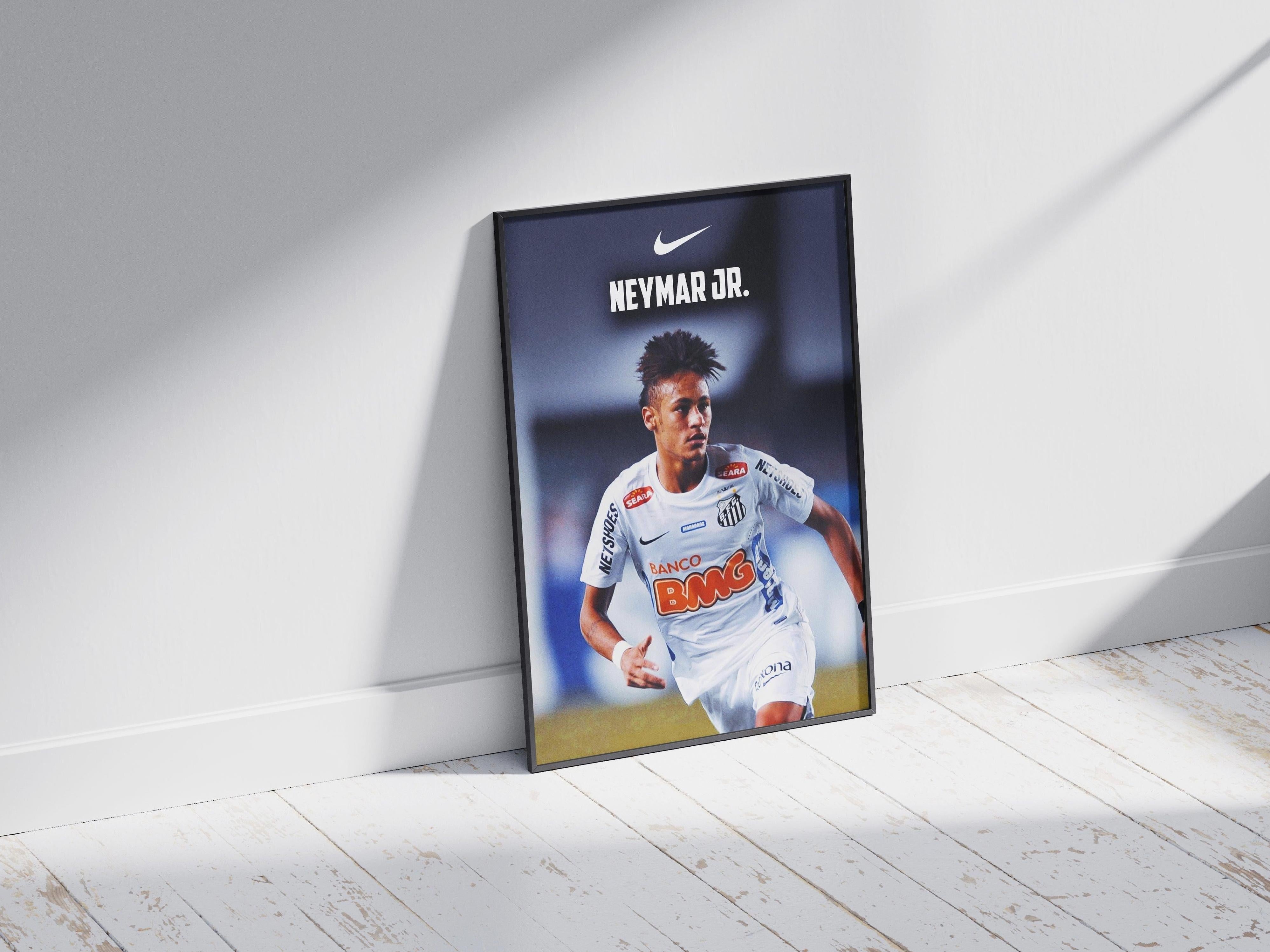 The Neymar Jr. x Santos Poster 2 by Retro1999 features Neymar Jr. in a white Santos FC kit, propped against a white wall on a light wooden floor—celebrating the iconic Copa Libertadores 2012 triumph.