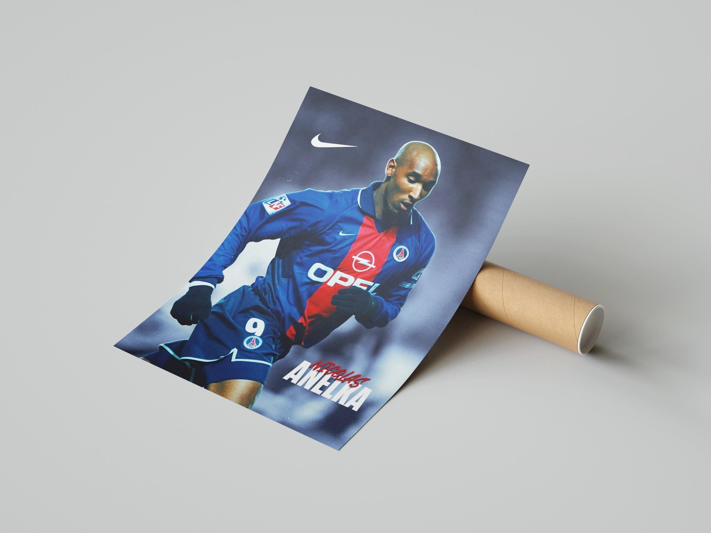 A rolled cardboard tube contains the Retro1999 Nicolas Anelka PSG Poster, featuring Anelka mid-action in the classic blue and red kit—a must-have collectible for football fans.