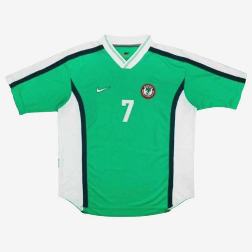 The Retro1999 Nigeria 1998 Home Shirt is a green and white short-sleeved soccer jersey with the number 7, an eagle emblem, and a Nike logo—a must-have for fans of classic football style.