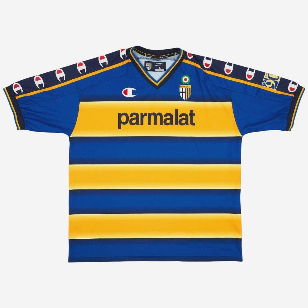 The Parma 2002-03 Home Shirt by Retro1999 features blue and yellow stripes, a “parmalat” sponsor, club badge, and iconic sleeve bands with Champion logos—a classic retro kit inspired by Serie A’s Parma.