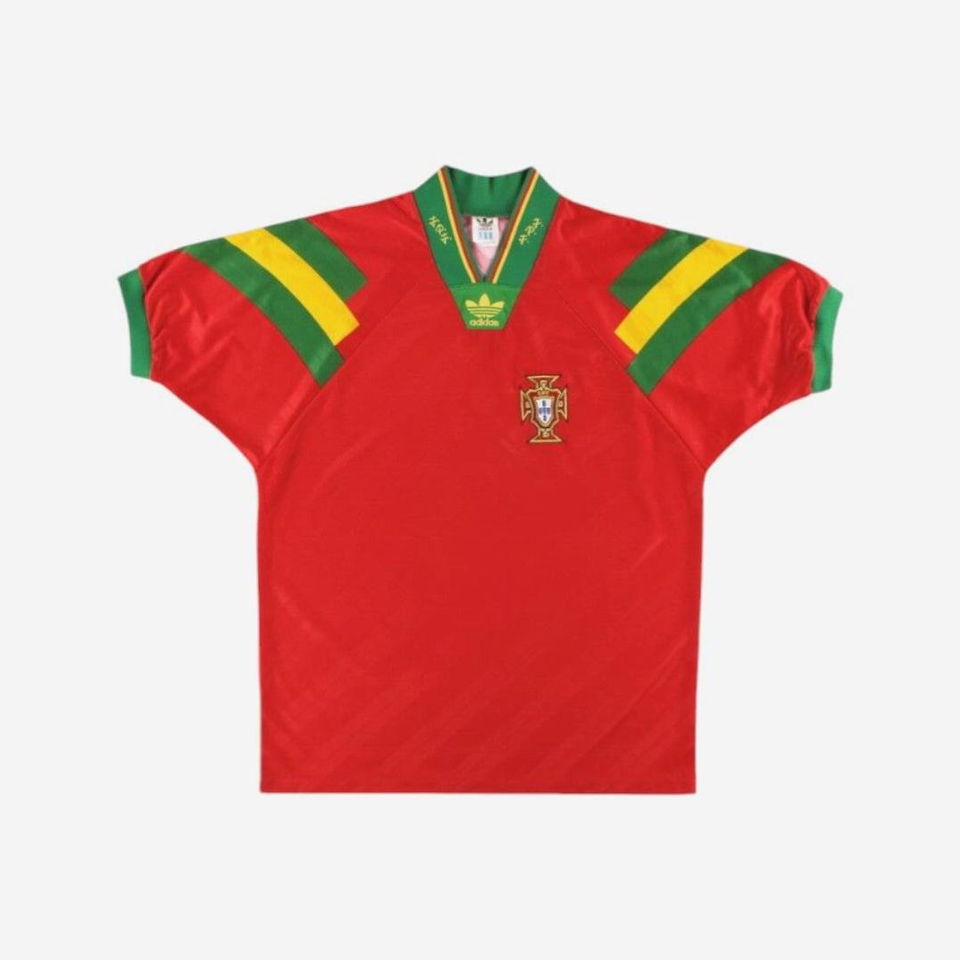 Retro1999 Portugal 1992/94 Home Shirt—vintage red football jersey with green and yellow sleeve stripes, Adidas logo, Portuguese crest on the chest, and green collar with yellow accents. Displayed on a white background.