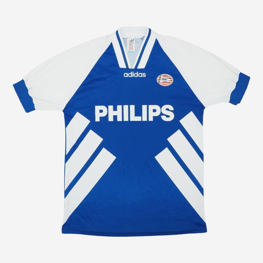 Blue and white PSV 1994-95 Away Shirt by Retro1999 featuring PHILIPS sponsor, white diagonal stripes, and club badge on the chest—a perfect retro football collectible for fans of classic kit style.