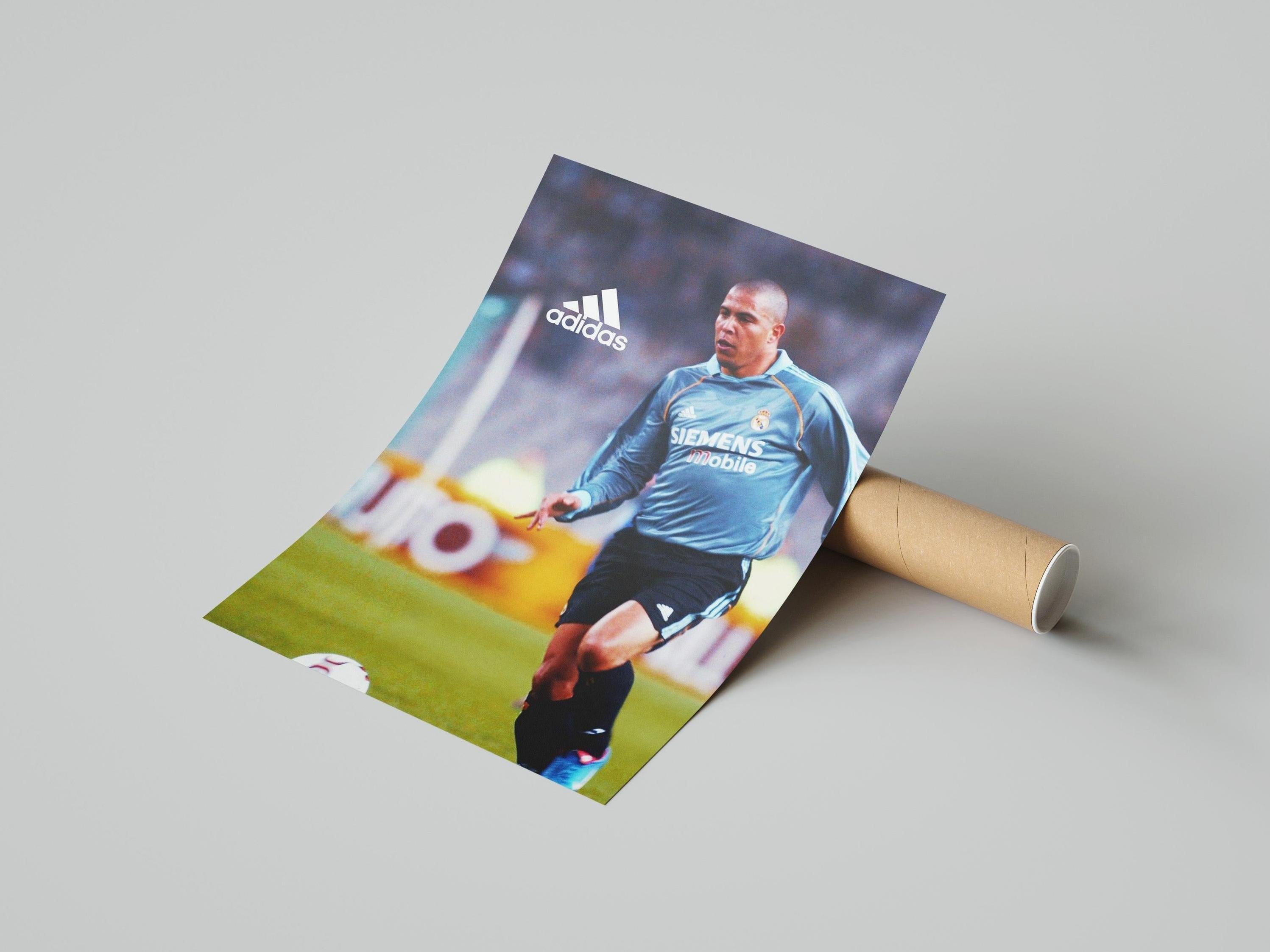 The Retro1999 R9 x Real Madrid Poster shows Ronaldo in a blue jersey dribbling on the field, with visible Adidas and Siemens Mobile logos—a must-have for football fans.