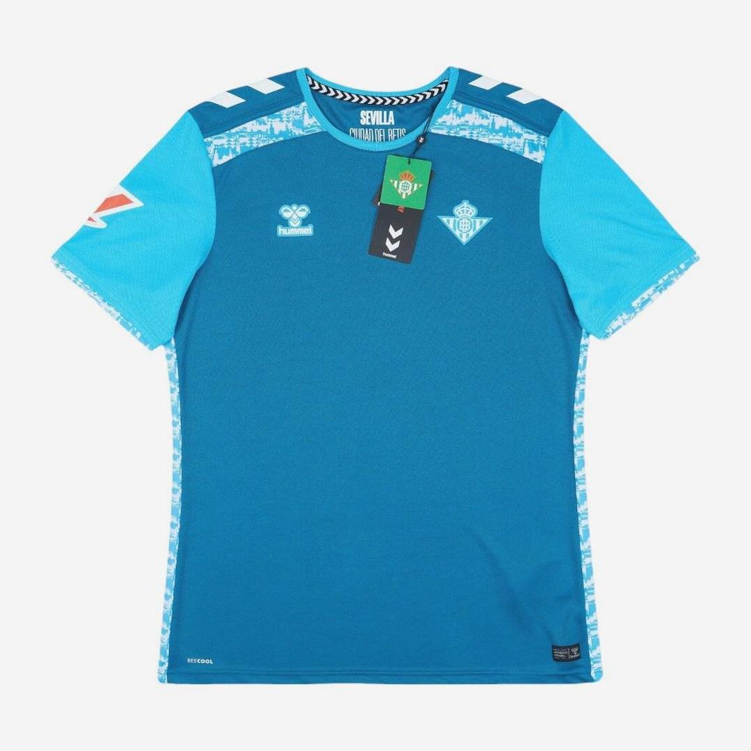 The Real Betis 2024-25 Third Shirt by Retro1999 features a blue design with light blue patterned accents, short sleeves, sponsor logos, and collar tags. This retro-style kit is displayed on a plain white background.