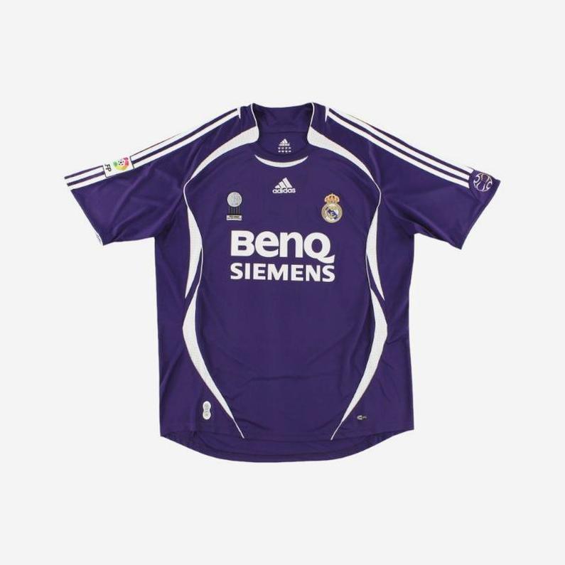 The Real Madrid 2006-07 Third Shirt by Retro1999 features a purple design with white accents, Adidas logo, BenQ Siemens sponsor, and club crest—a classic retro football kit shown laid flat on a white background.