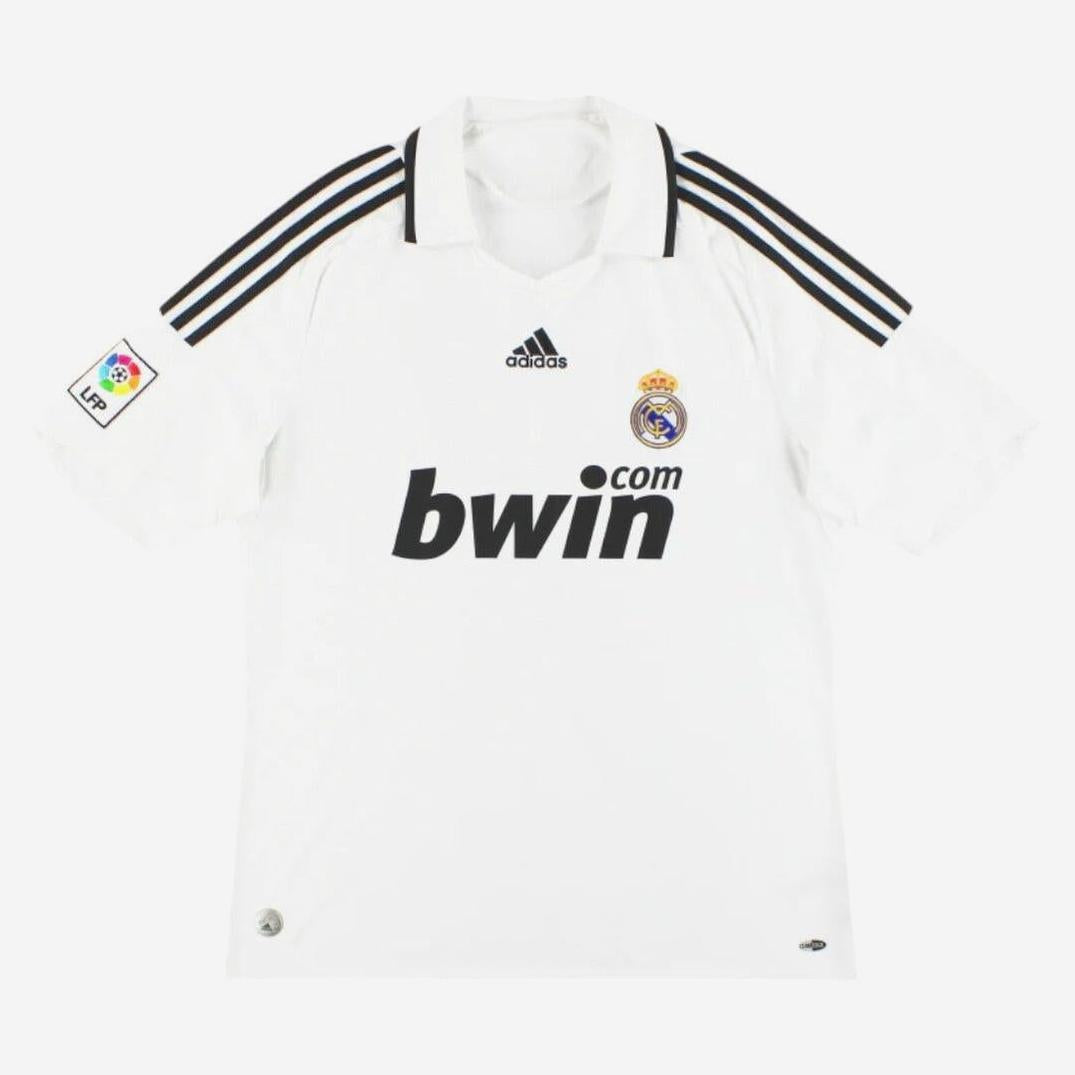 The Retro1999 Real Madrid 2008-09 Home Shirt is white with black Adidas stripes, bwin.com sponsor, club crest, and La Liga patch on the left sleeve—ideal for fans of vintage and retro kits.