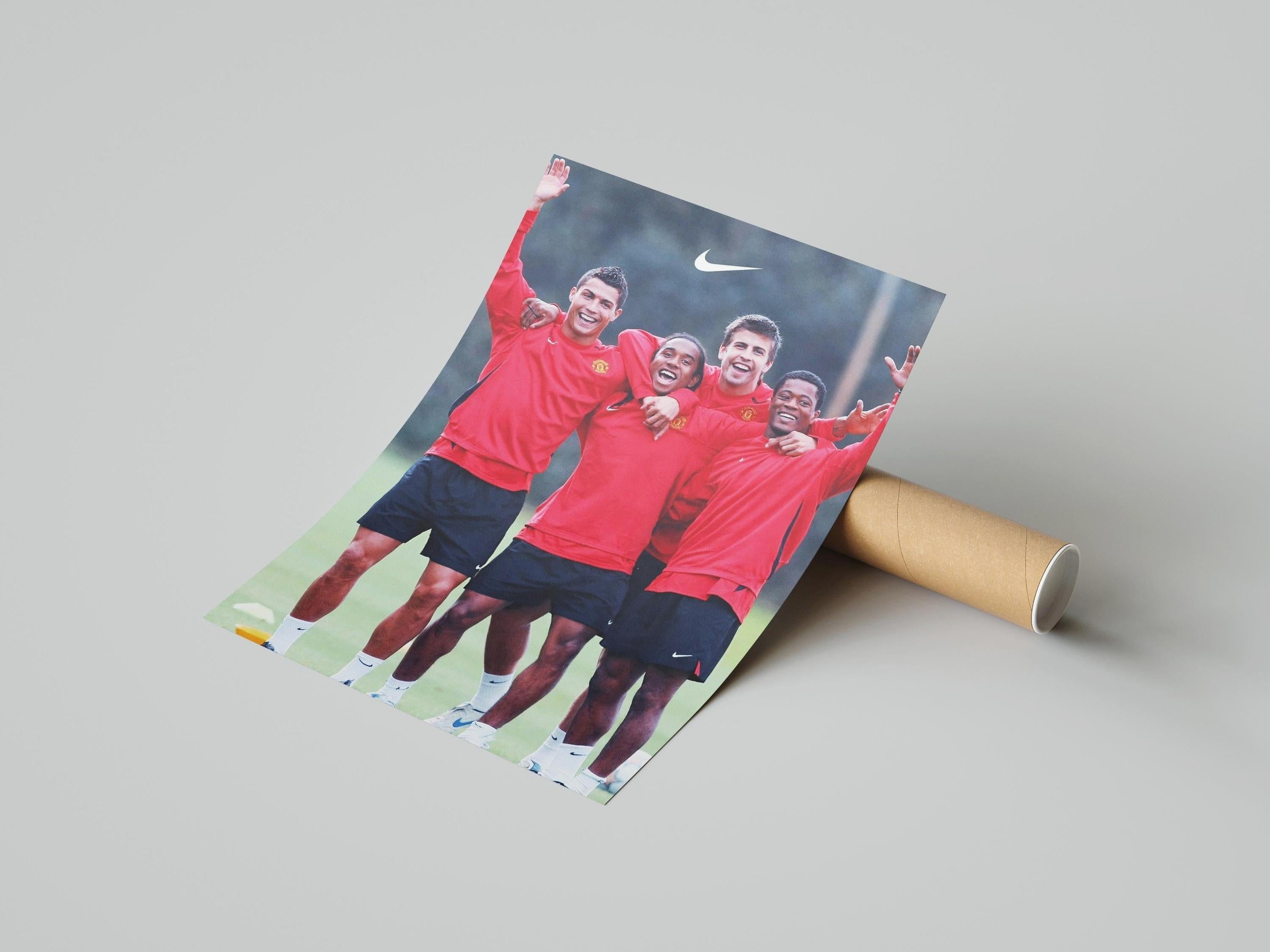 The Retro1999 Ronaldo x Anderson x Pique x Evra Poster features four football legends in red Manchester United jerseys on the field, smiling with arms around each other. The Nike logo is displayed above them.