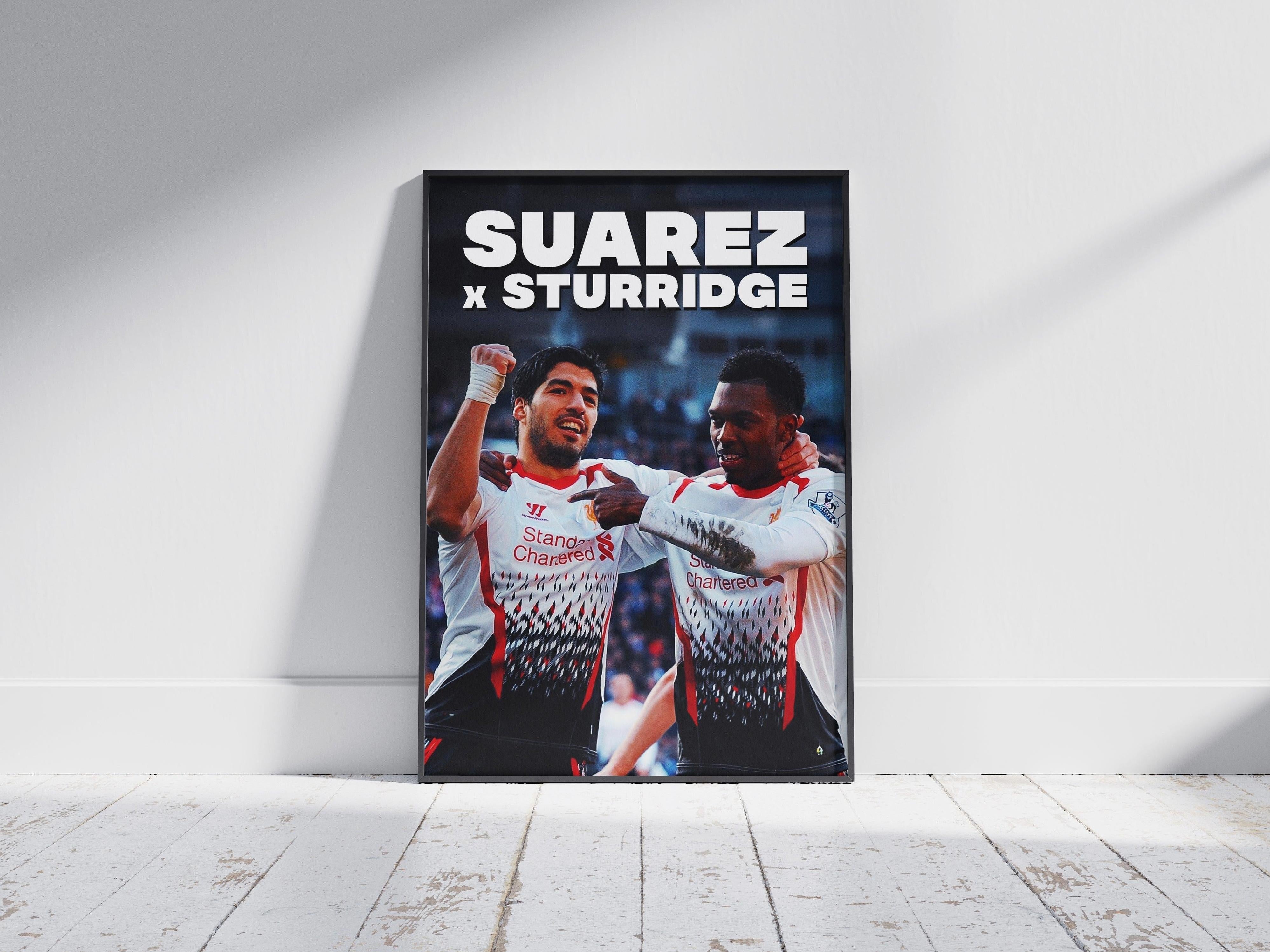 The Sturridge x Suarez Poster by Retro1999 shows two footballers celebrating on a wooden floor, with bold white capital letters above reading Sturridge x Suarez—a standout piece of football memorabilia.