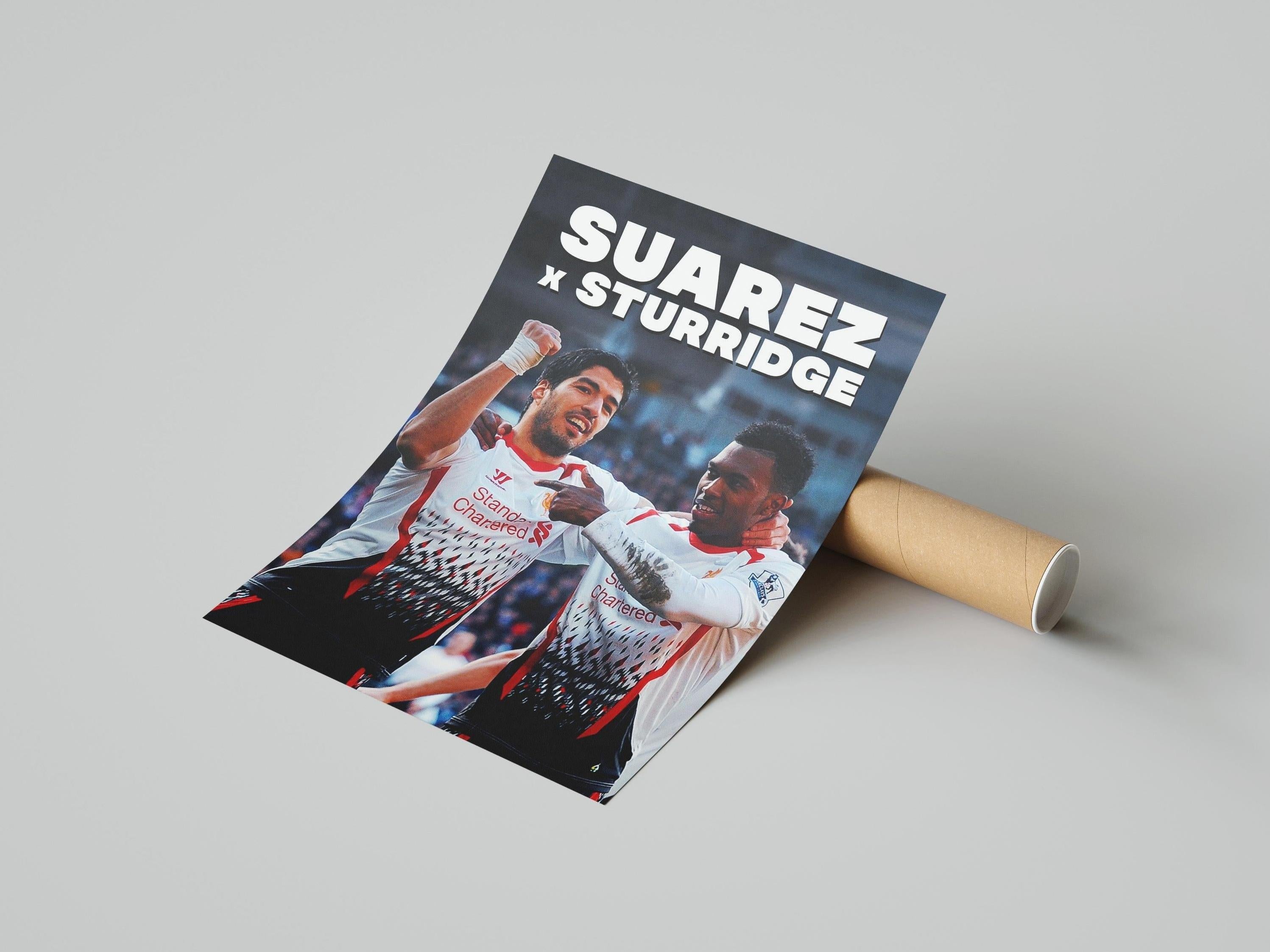 The Sturridge x Suarez Poster by Retro1999 features two soccer players in white and red celebrating below bold “SUAREZ x STURRIDGE” lettering against a blurred stadium—ideal football memorabilia for fans.
