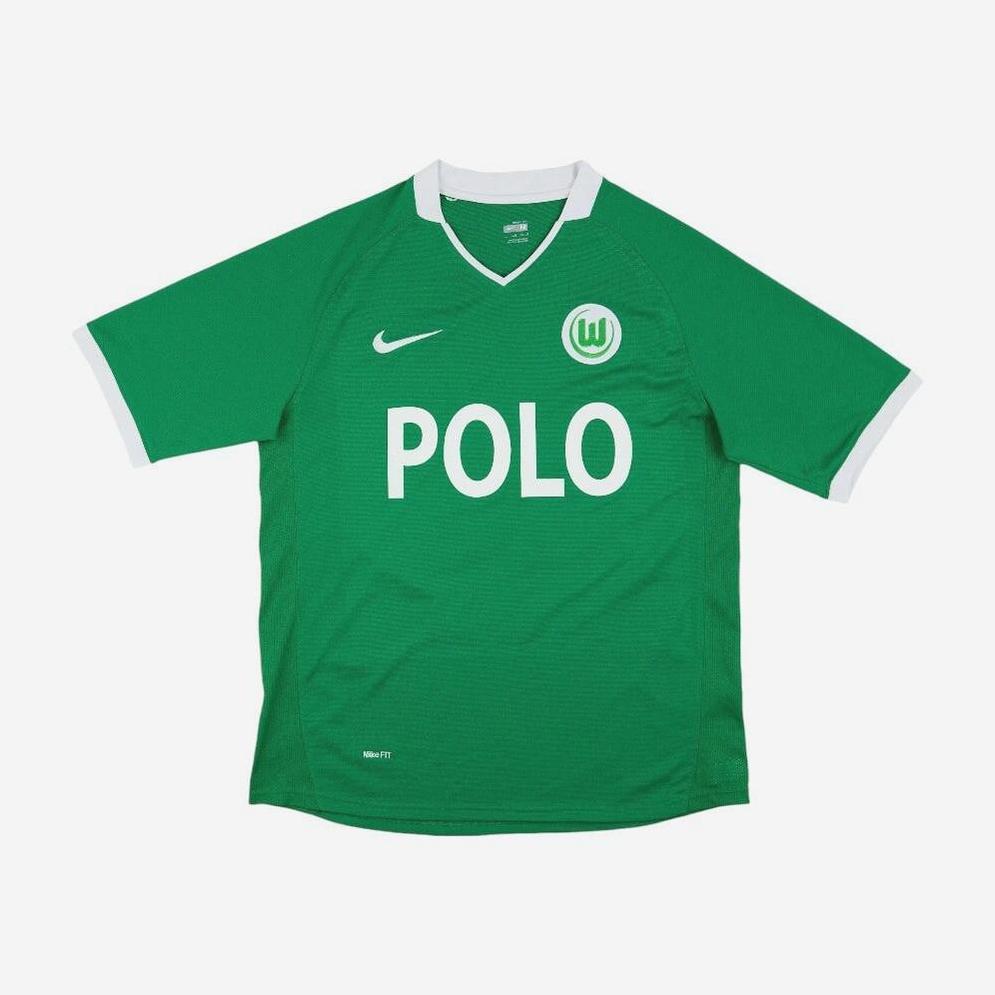 The Retro1999 Wolfsburg 2008-09 Home Shirt is a green jersey with white trim, the club’s circular W crest, and bold POLO lettering—a classic retro kit for fans.