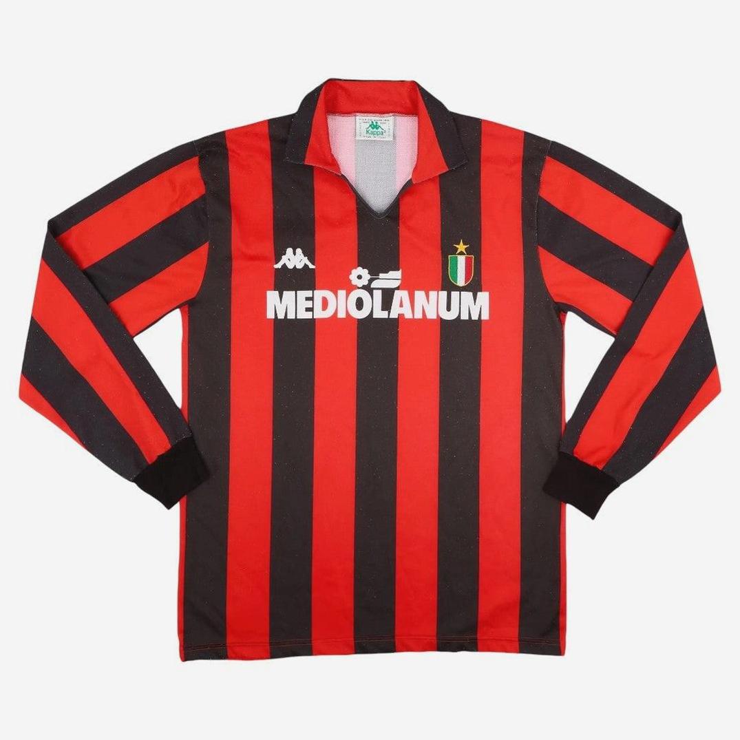 The AC Milan 1988-89 Longsleeve Home Shirt by Retro1999 features classic black and red stripes, a black collar and cuffs, Kappa logo, Mediolanum sponsor, and chest shield—ideal for any Serie A supporter.