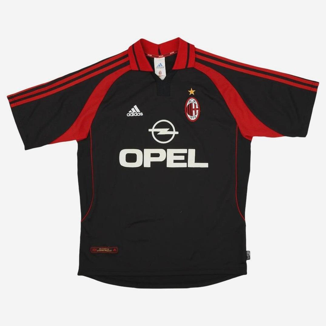 The AC Milan 2000-01 Third Shirt by Retro1999 features a black and red design, Adidas and Opel logos, a gold star above the crest, and red shoulder stripes—a classic Serie A retro kit.