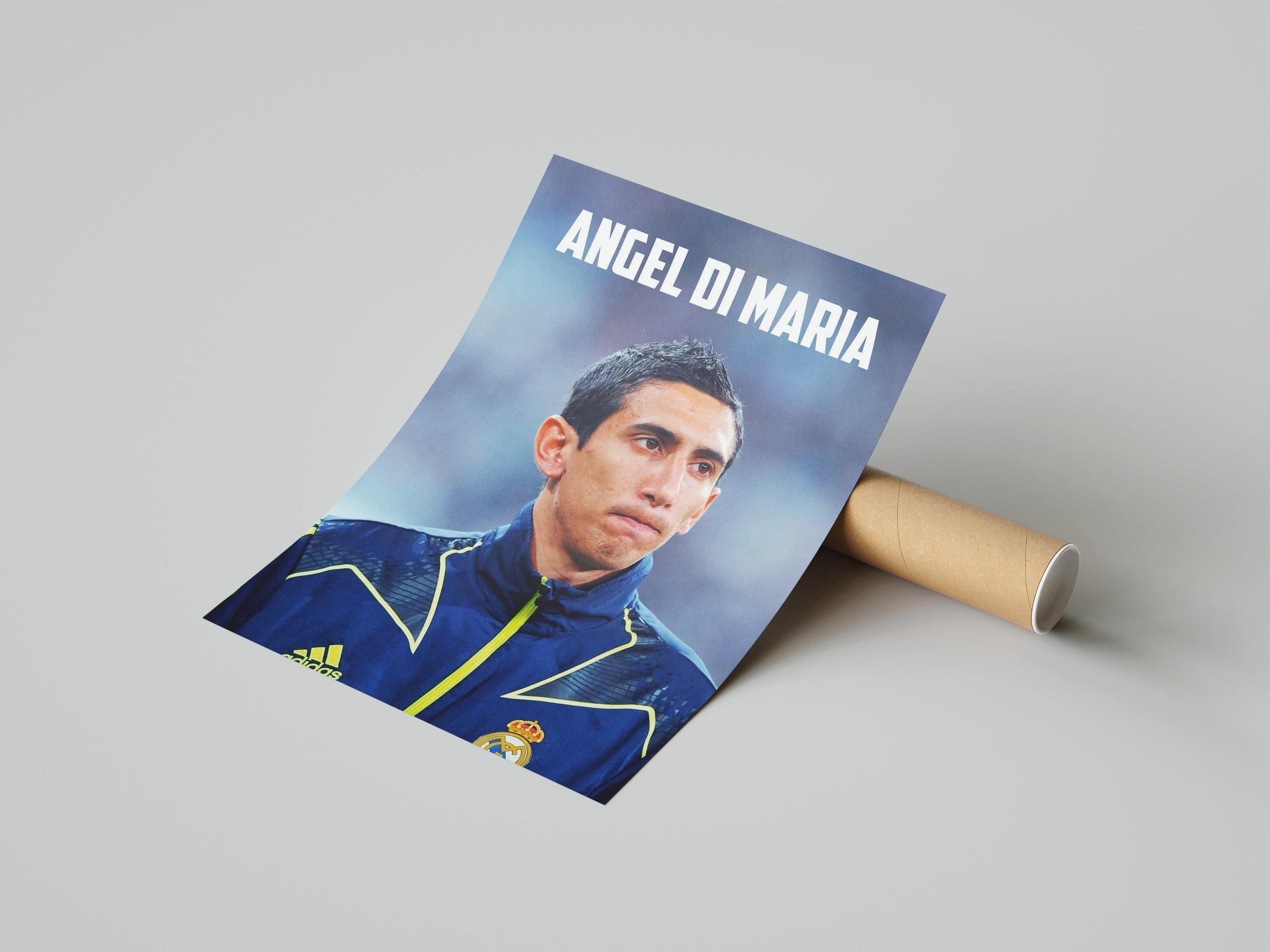 The Retro1999 Angel Di Maria RMA Poster showcases the soccer star in a dark blue Real Madrid jacket, with ANGEL DI MARIA in bold white lettering—an iconic tribute for fans and football history enthusiasts.