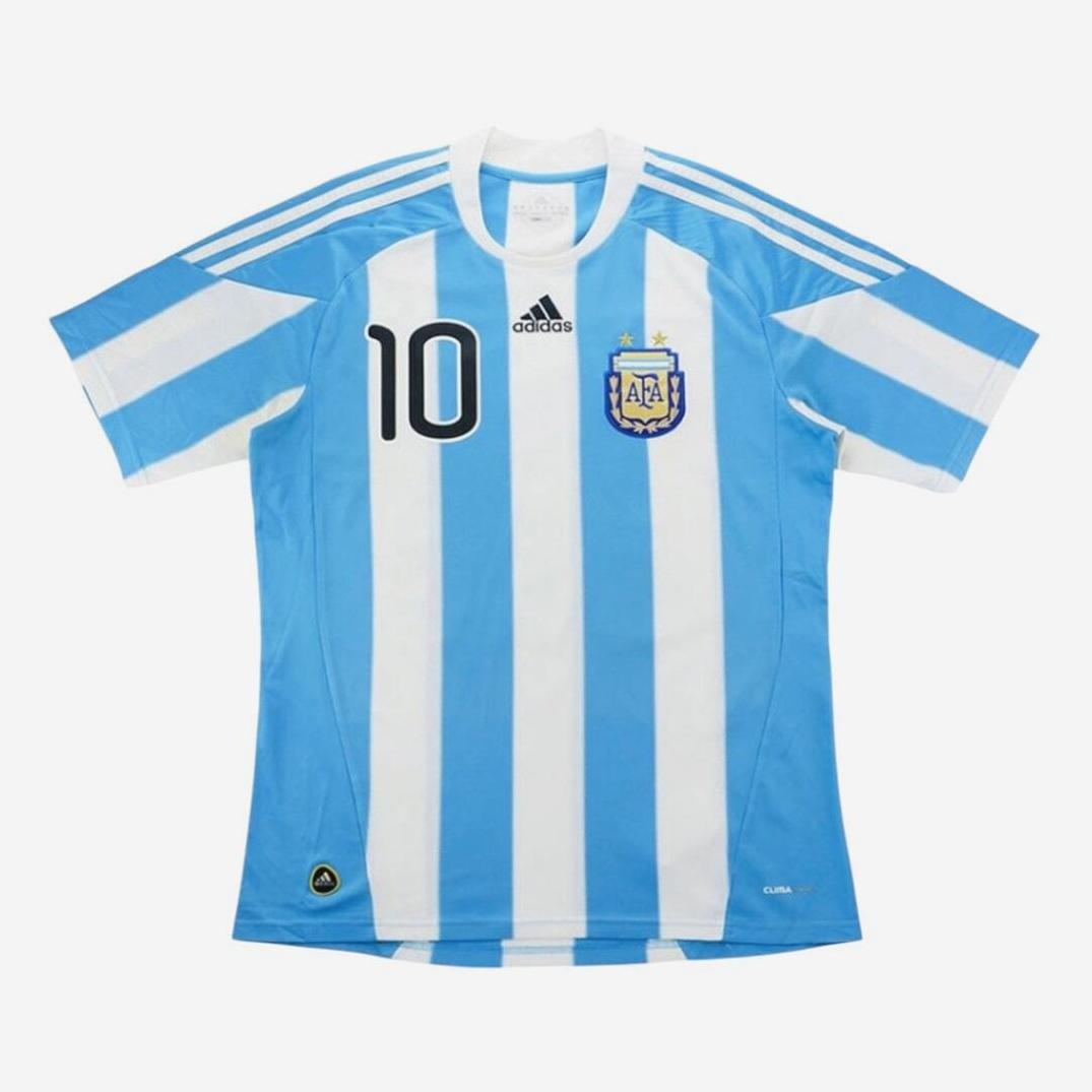 Front view of the Argentina 2010 Home Shirt by Retro1999, featuring light blue and white stripes, number 10, and team crest—an iconic retro kit honoring Argentina’s football heritage.