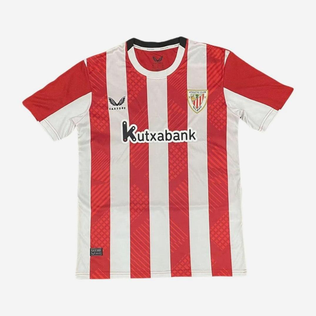 The Athletic Bilbao 2024-25 Home Shirt by Retro1999 features classic red and white stripes, Kutxabank sponsor, club crest, Castore logo, short sleeves with bold red shoulders—a must-have for La Liga fans.