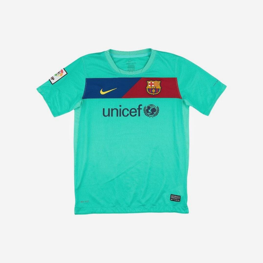 The Retro1999 Barcelona 2010-11 Away Shirt in mint green, with blue and red chest stripe, club crest, Nike logo, and UNICEF sponsor, is laid flat on a white background—a classic retro kit for football fans.