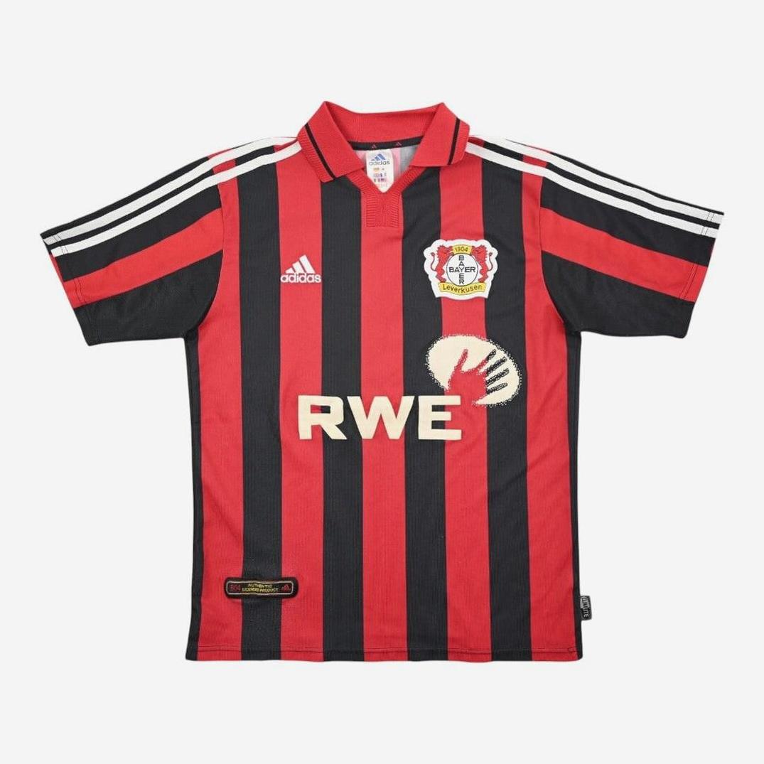 The Bayer Leverkusen 2001-02 Home Shirt by Retro1999 features black and red stripes, white accents, three white shoulder stripes, the club logo, and RWE sponsor—an iconic retro kit for true fans.