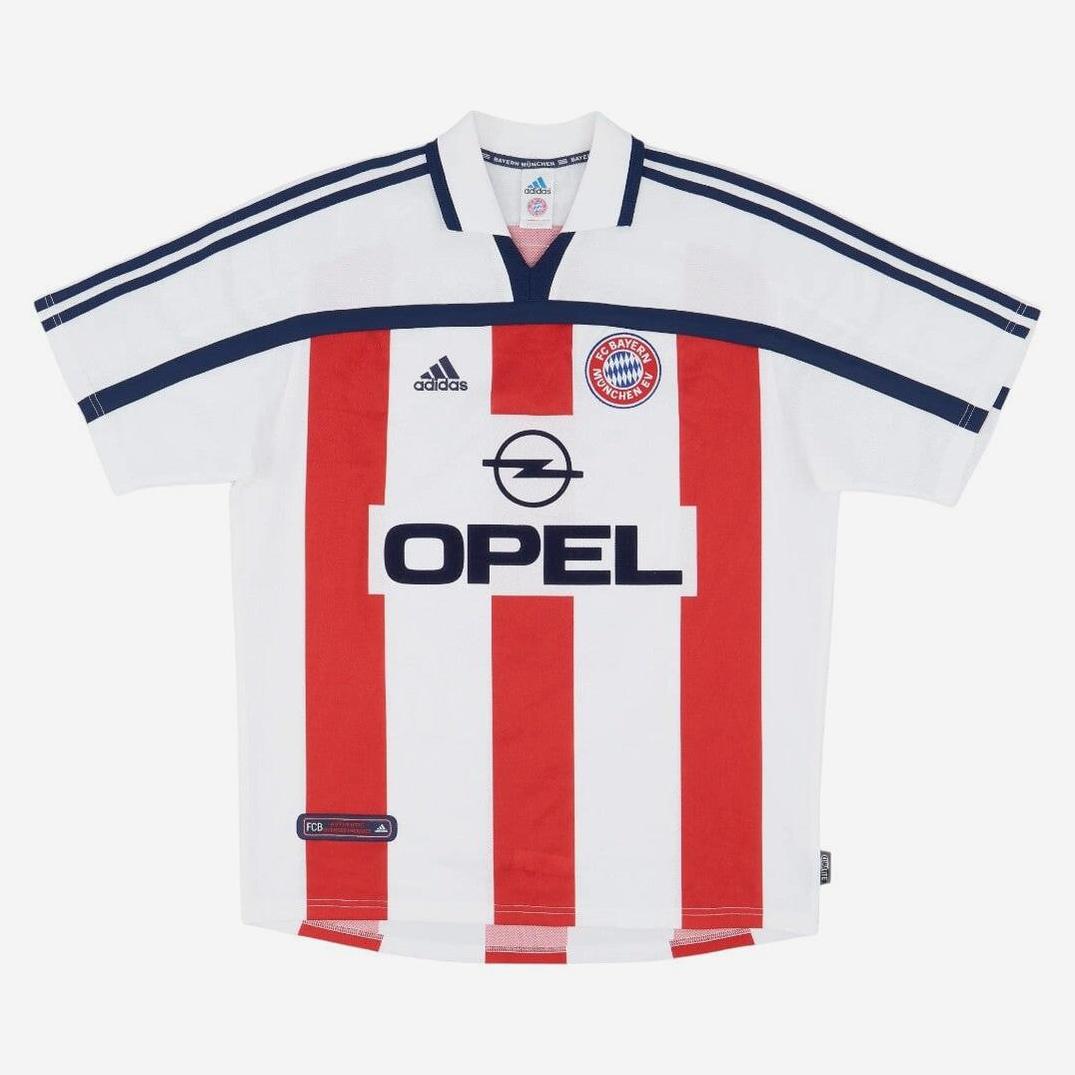 The Retro1999 Bayern Munich 00-01 Away Shirt features a white design with red stripes, dark blue collar and shoulder details, Opel sponsor, and club badge—an iconic retro kit for Bundesliga fans.