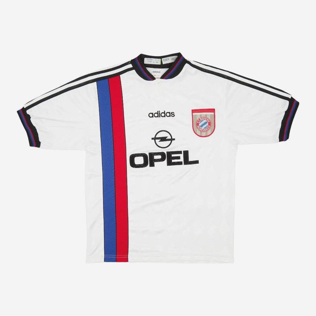 The Retro1999 Bayern Munich 1996-98 Away Shirt is a vintage white jersey with black collar and sleeve trim, featuring a red and blue vertical stripe, club crest, and OPEL sponsor logo on the front in a classic retro design.