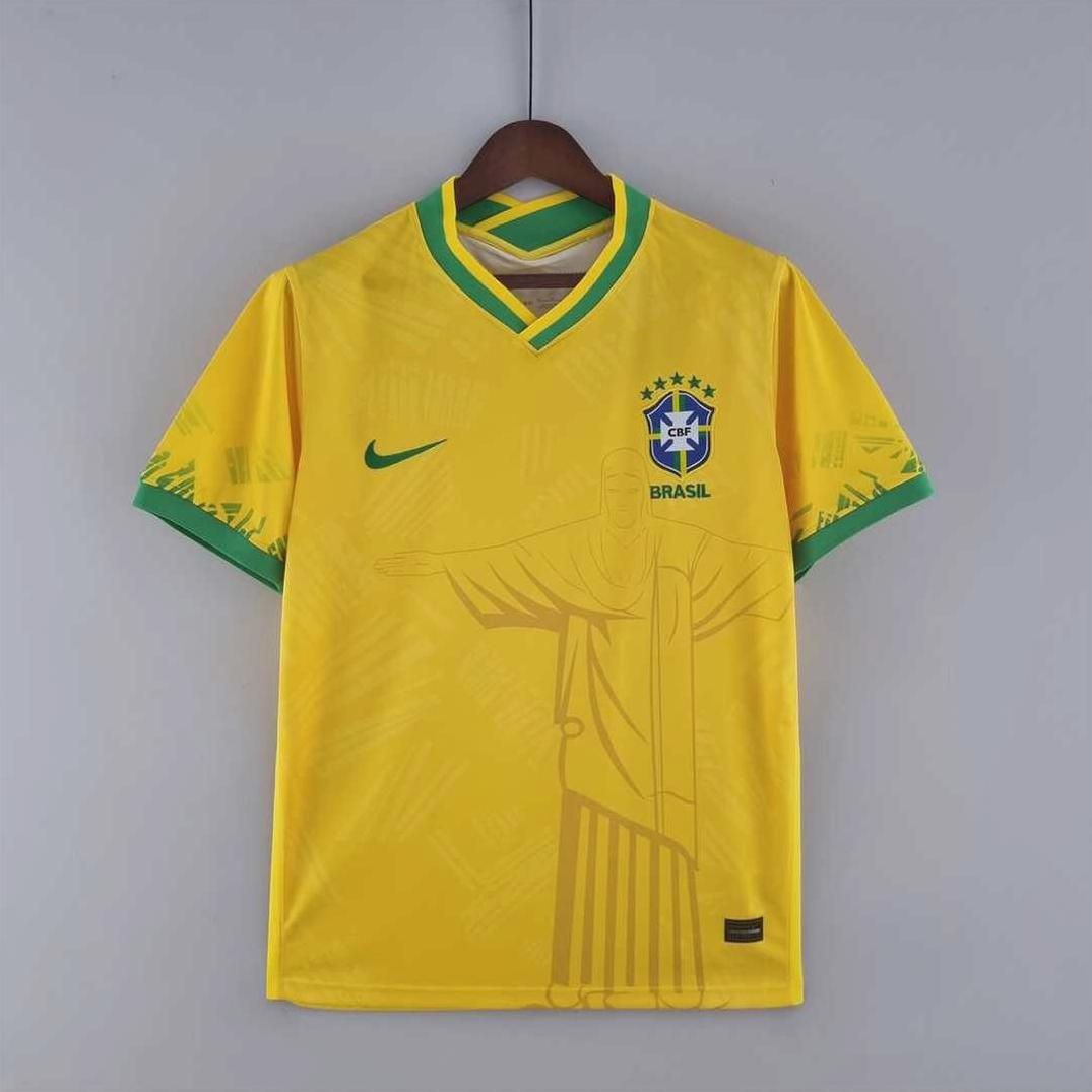 The Retro1999 Brazil 2022 Home Shirt Special, in yellow with green accents, displays the team crest, Nike logo, and a subtle Christ the Redeemer graphic on the front—an iconic piece of Brazilian football heritage.