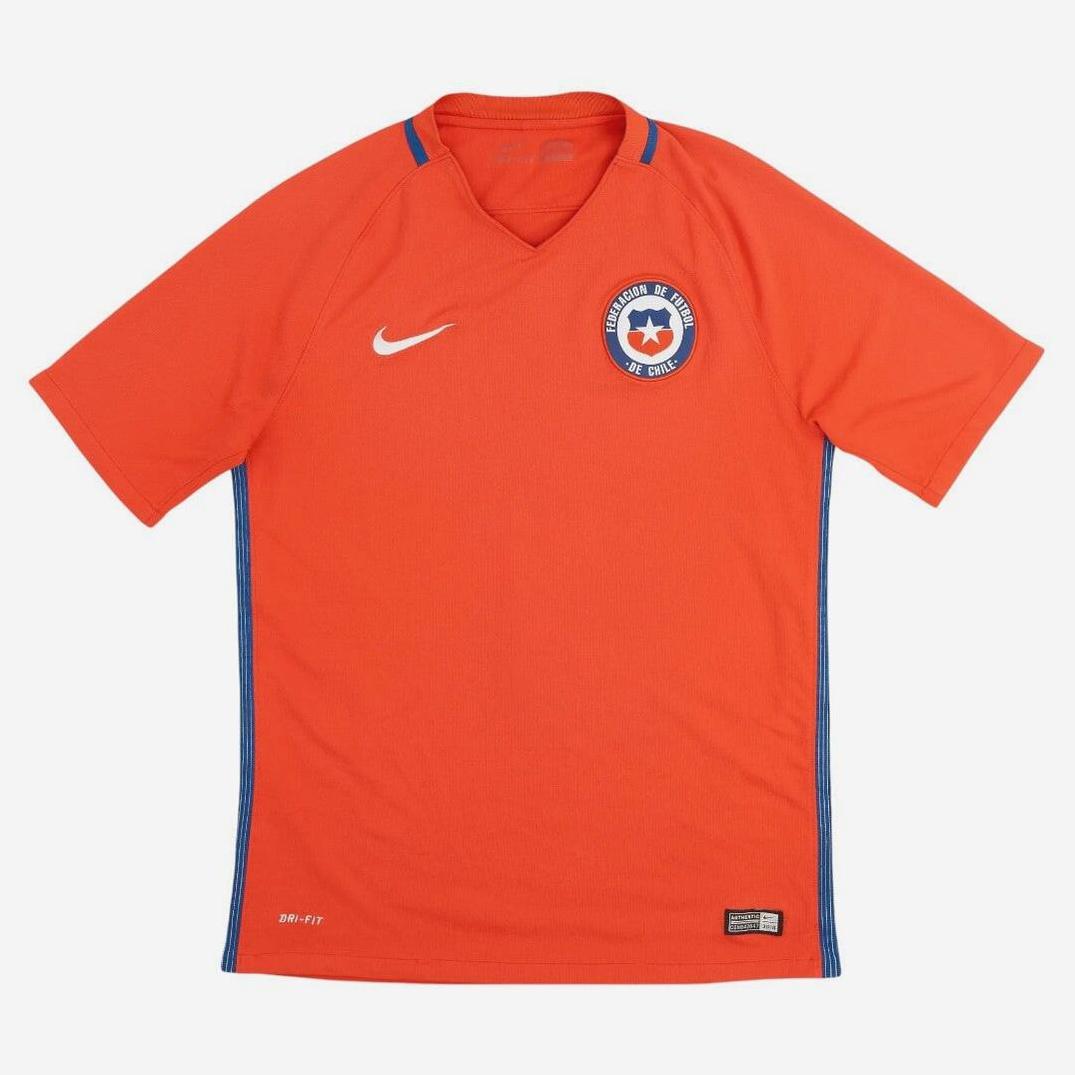 This Retro1999 Chile 2016 Home Shirt is an orange short-sleeve soccer jersey with blue trim, featuring the national team crest on the left chest and a white Nike logo on the right—ideal for retro kit fans.