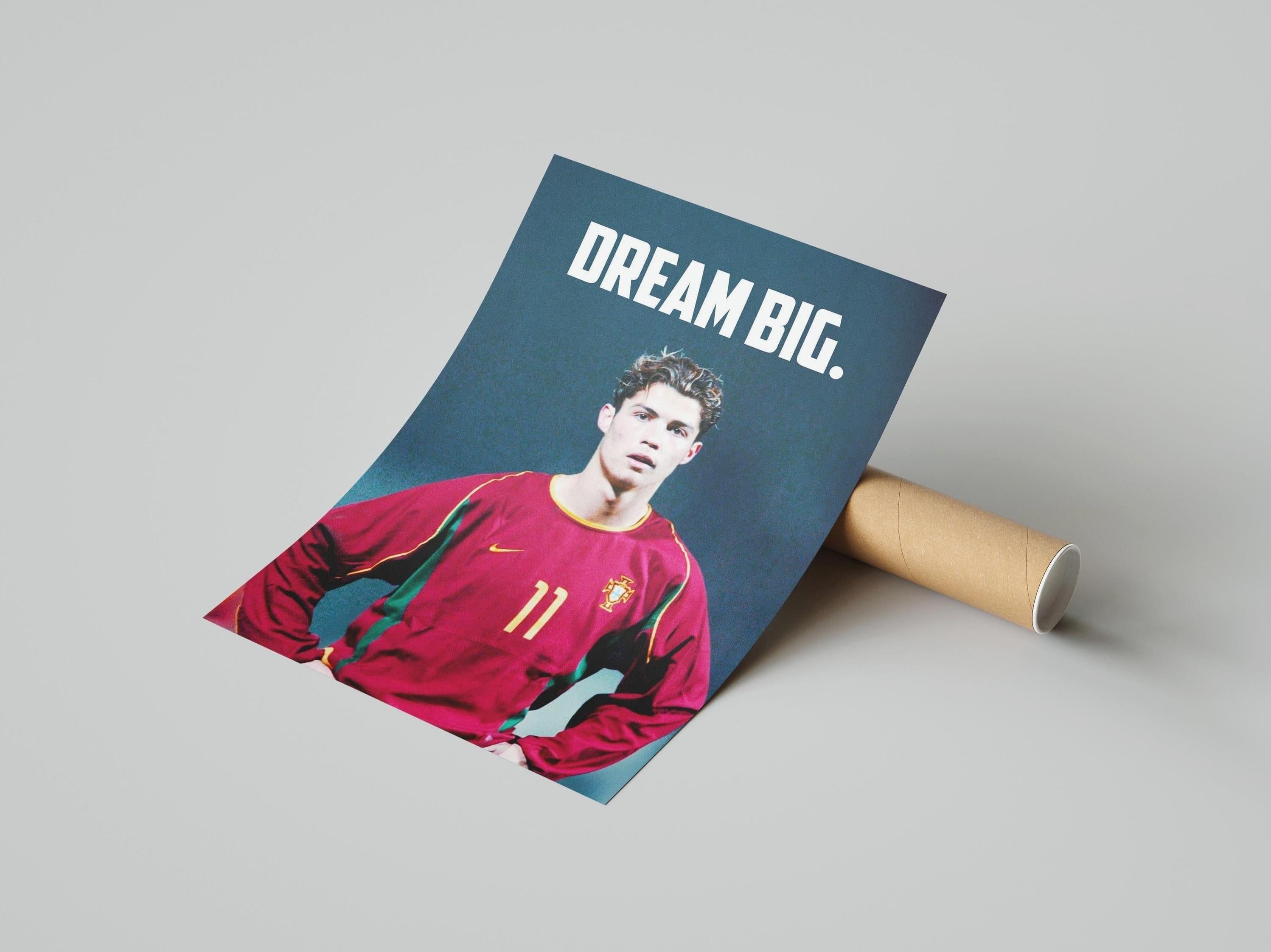 The CR7 x Portugal Poster by Retro1999 shows a young male soccer player in a red #11 jersey under bold DREAM BIG. text on a dark background—ideal decor for football fans and Cristiano Ronaldo supporters.
